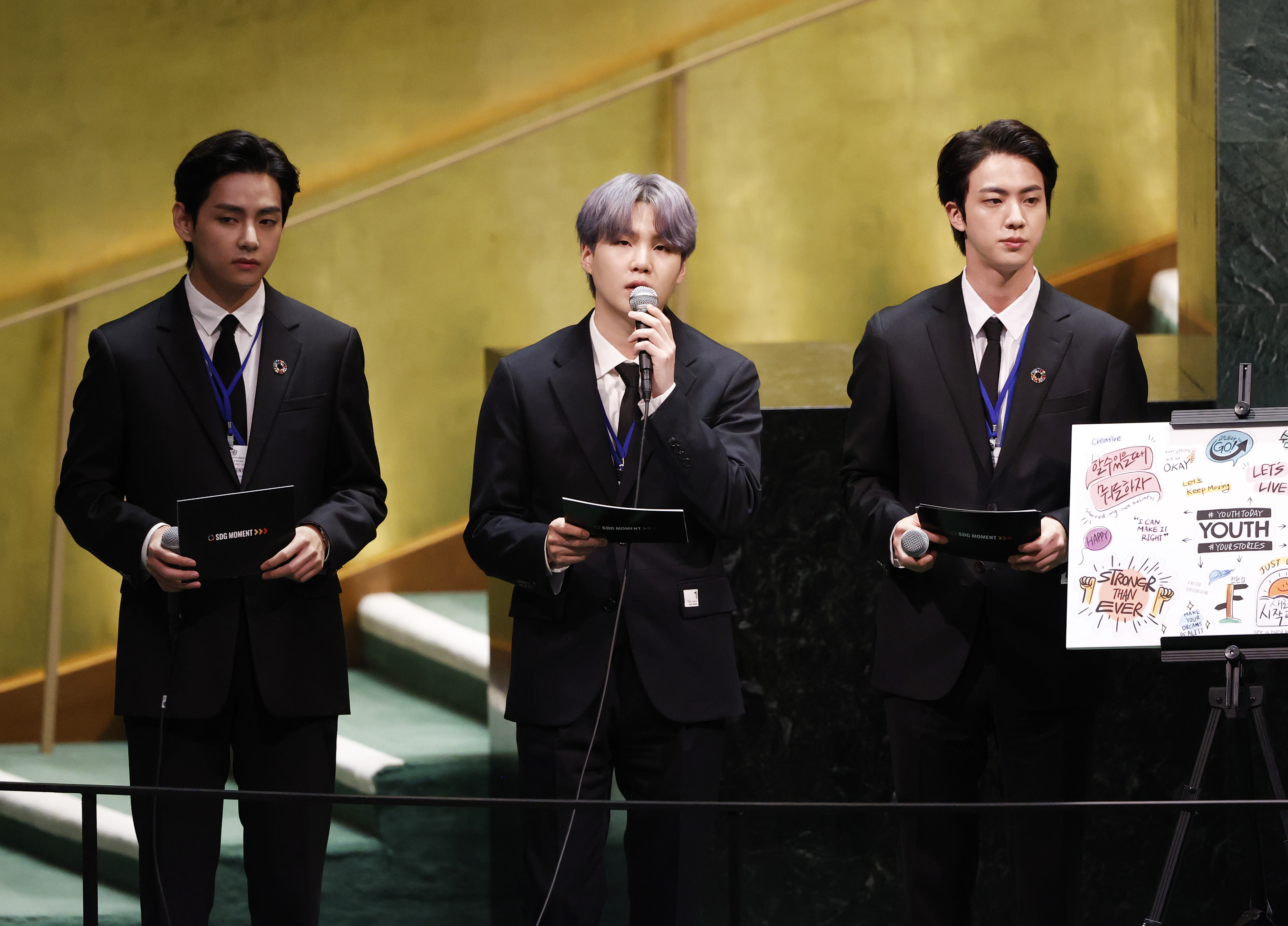 Taehyung/V, Suga, and Jin of boy band BTS take turns speaking at the SDG Moment event as part of the UN General Assembly