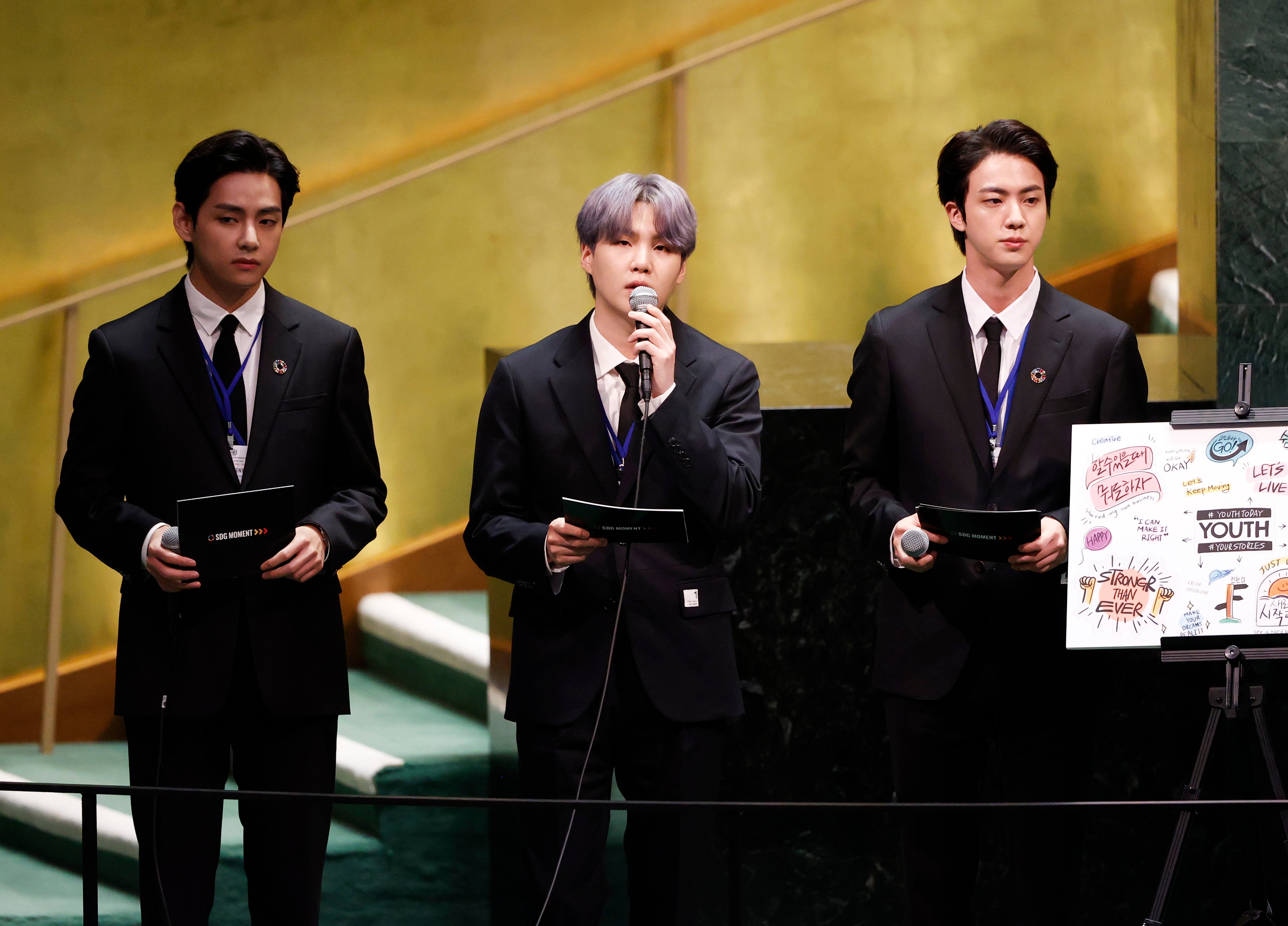 Taehyung/V, Suga, and Jin of boy band BTS take turns speaking at the SDG Moment event as part of the UN General Assembly