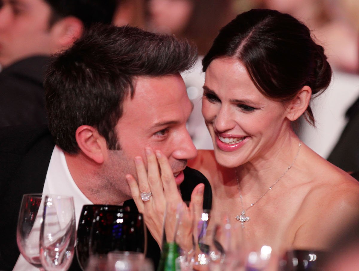 Ben Affleck and Jennifer Garner laugh together at an event.