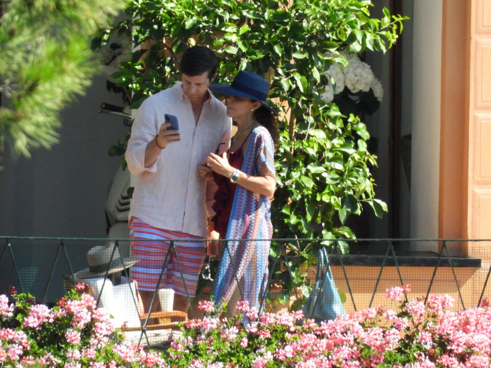 RHONY's Bethenny Frankel and Paul Bernon are seen looking at their phone at their hotel on July 7, 2021, in Italy