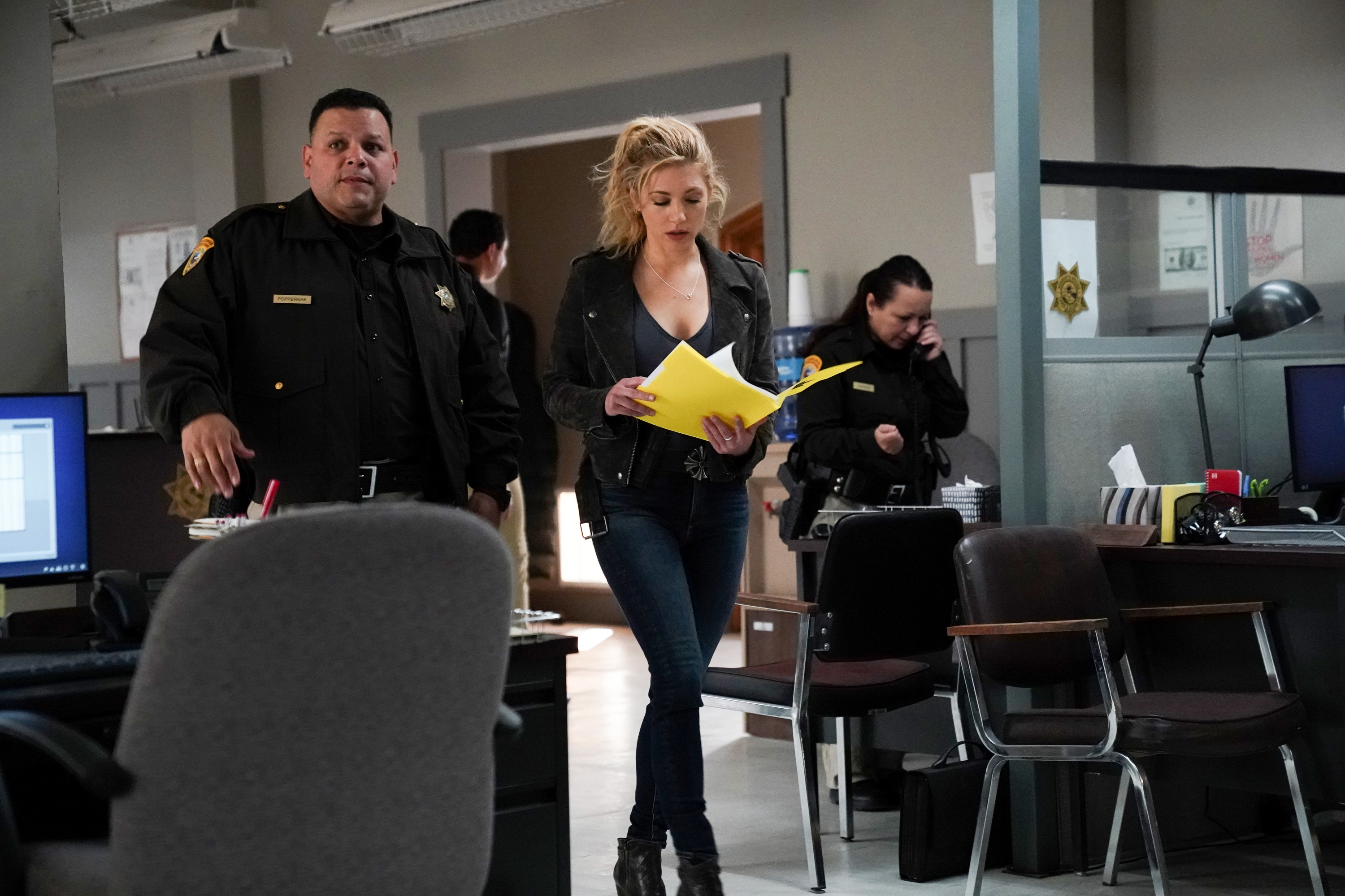 'Big Sky' J. Anthony Pena and Katheryn Winnick walking in the police station