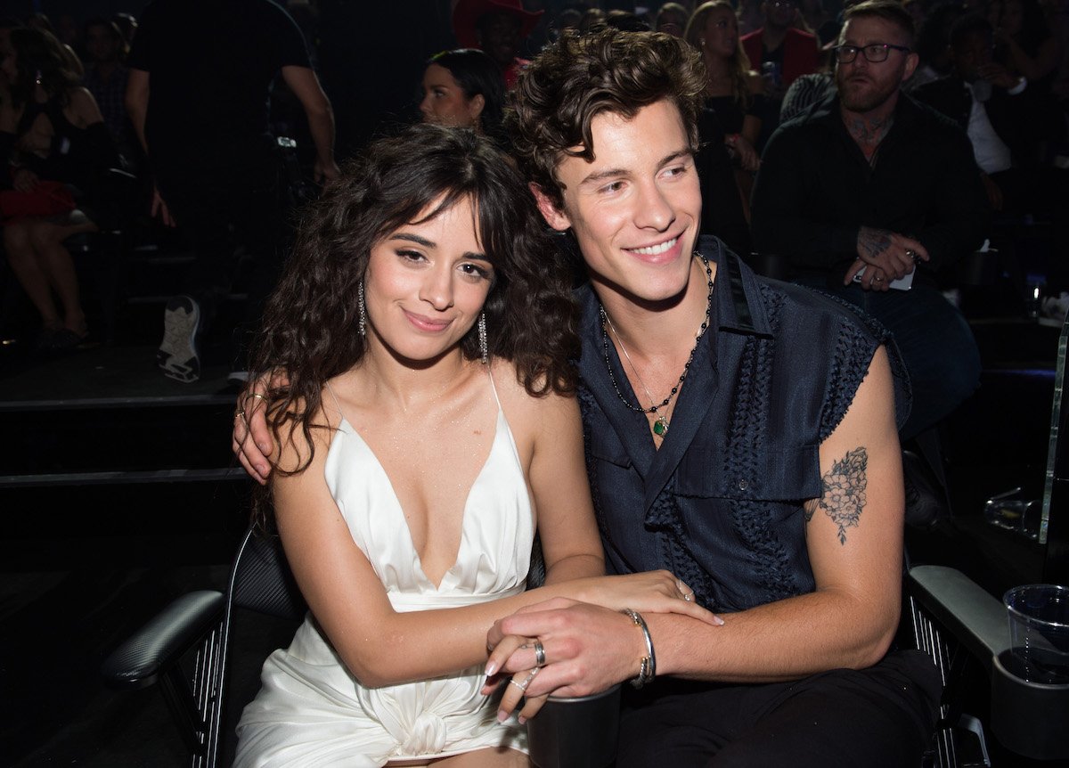 Camila Cabello and Shawn Mendes pose together at an event.