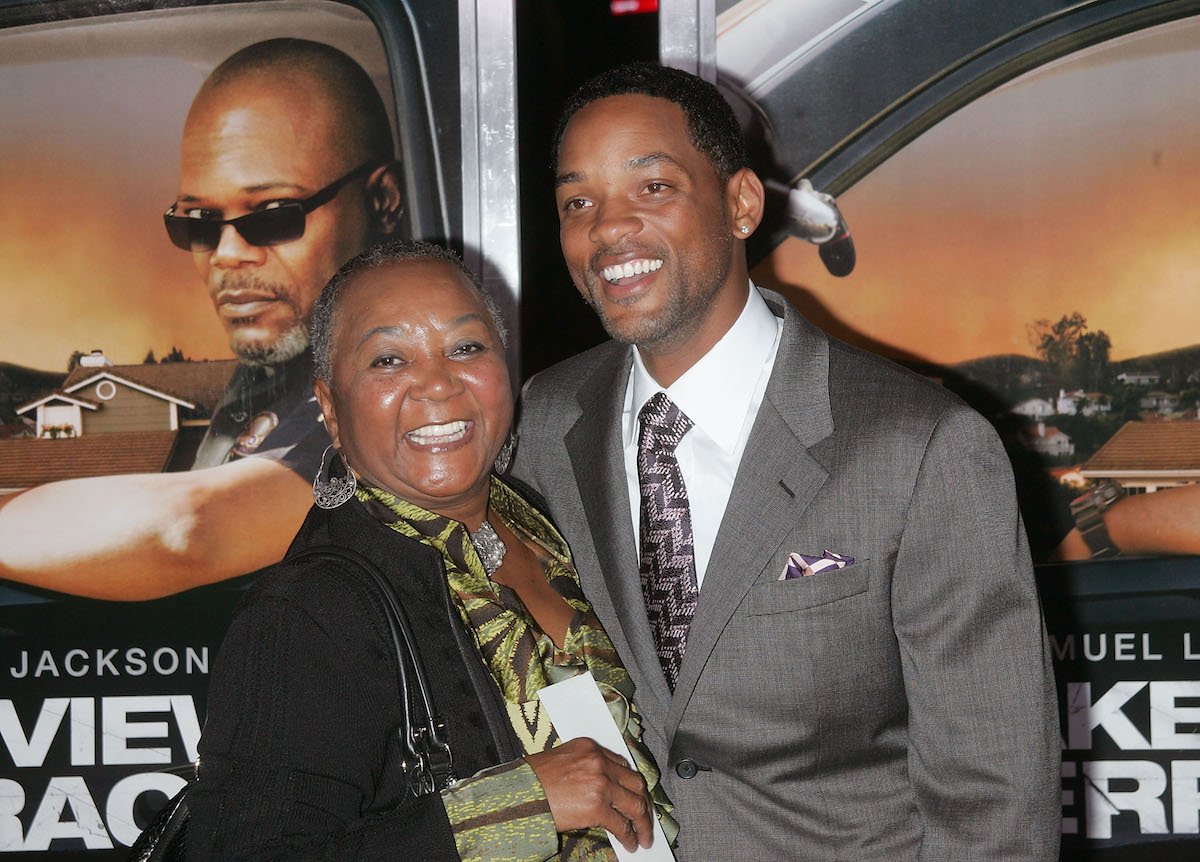 Caroline Smith and Will Smith pose together at an event.
