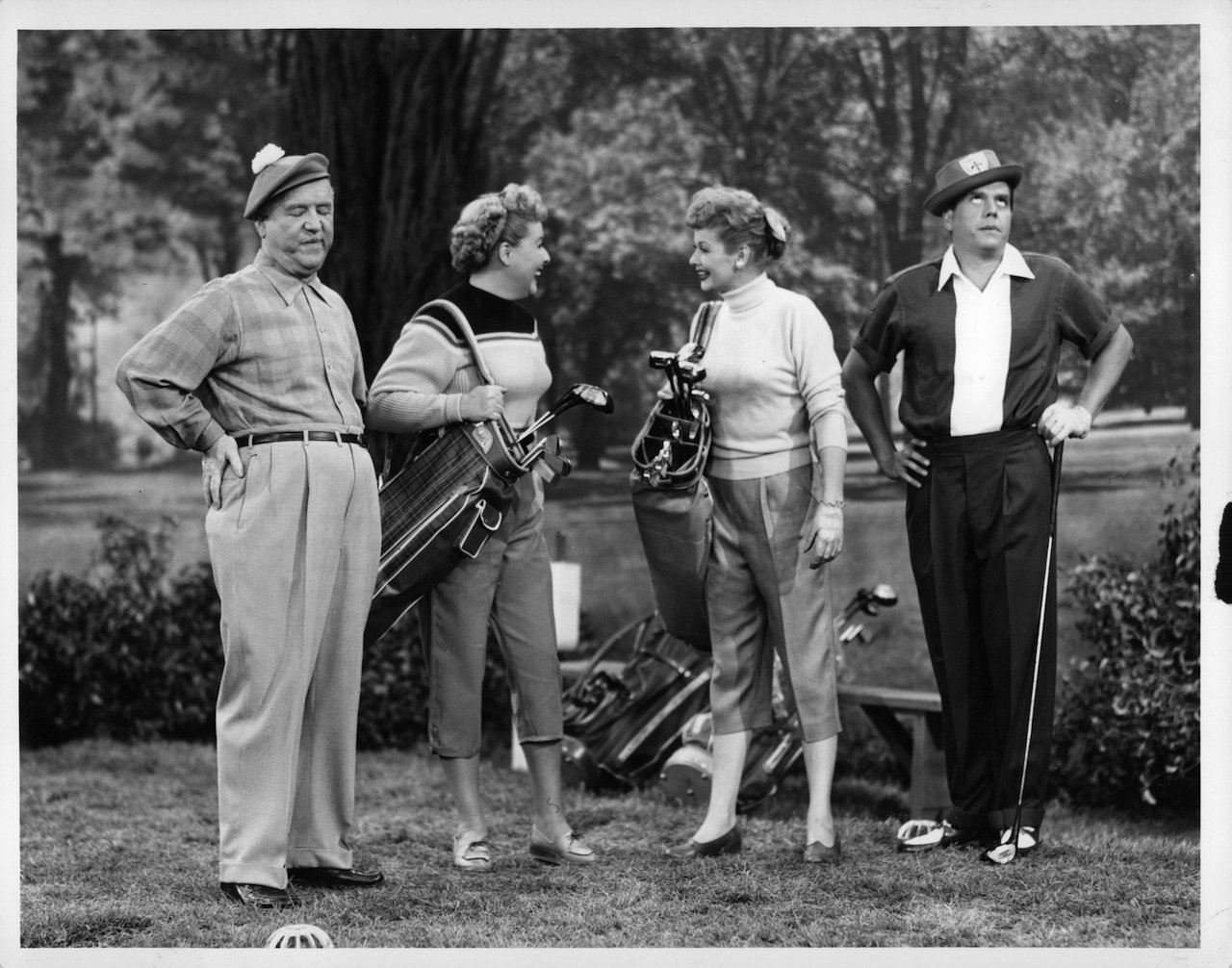 William Frawley, Vivian Vance, Lucille Ball, and Desi Arnaz out golfing in the television series 'I Love Lucy'