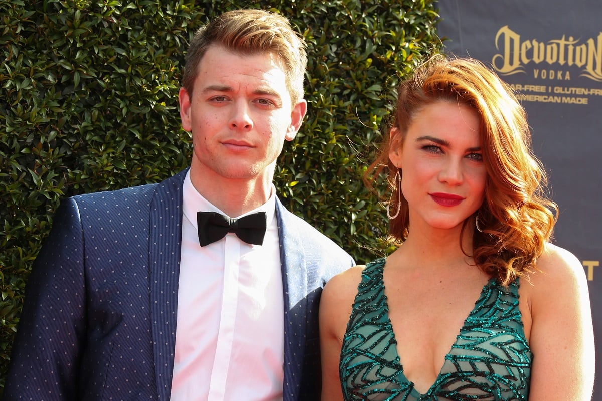 'General Hospital' actor Chad Duell in a blue suit and 'The Young and the Restless' actor Courtney Hope in a green dress.
