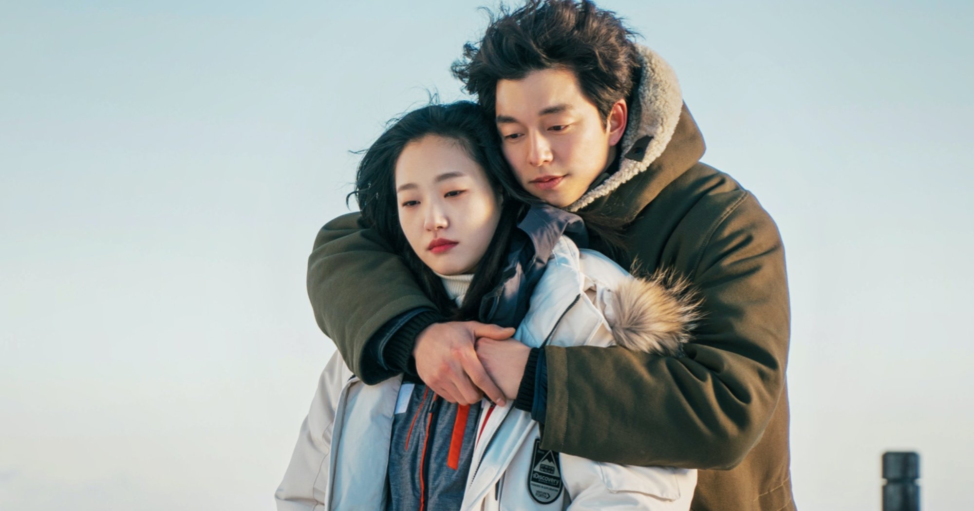 Characters Eun-tak and Kim Shin from 'Guardian the Lonely and Great God' romance K-drama embracing in the cold.