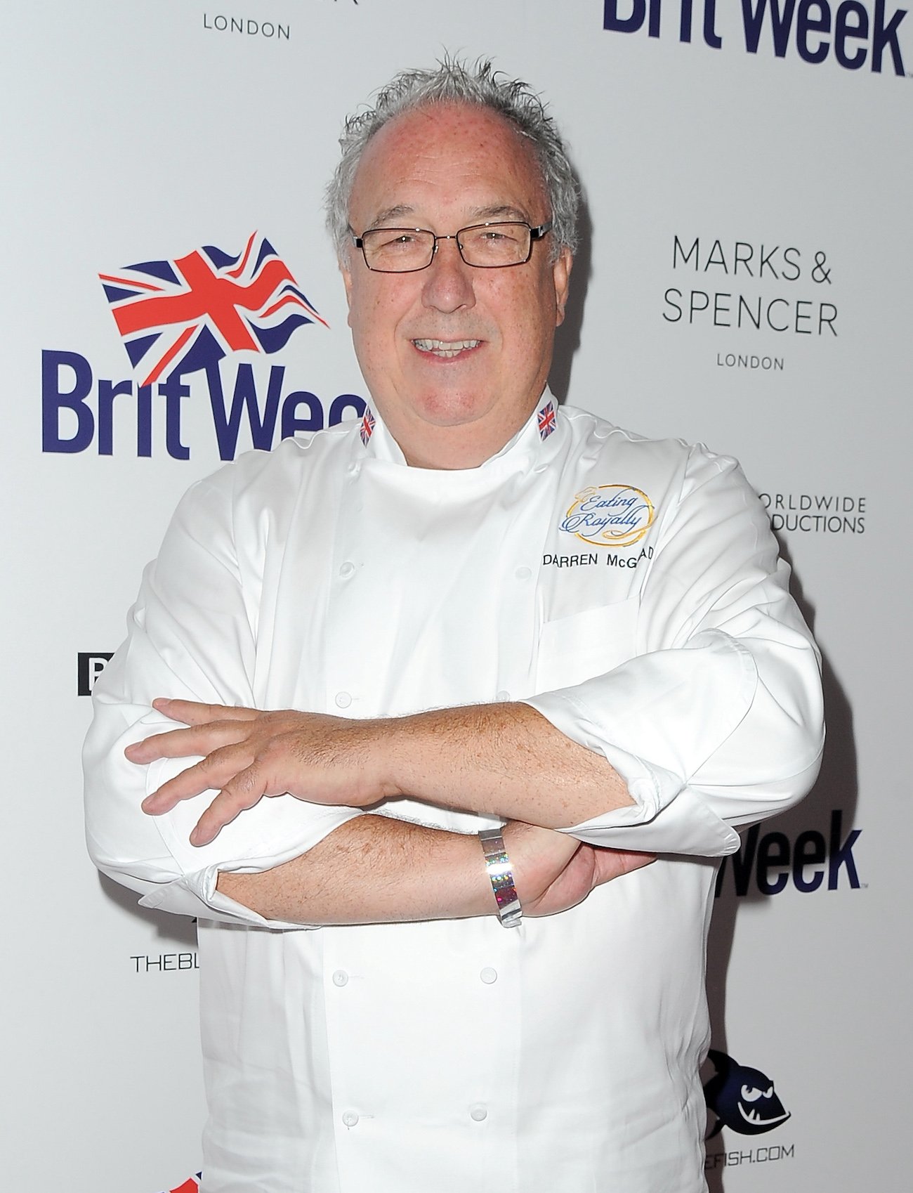Darren McGrady smiles with his arms folds over his chest wearing a white chef's coat at BritWeek's 10th Anniversary Reception in 2016