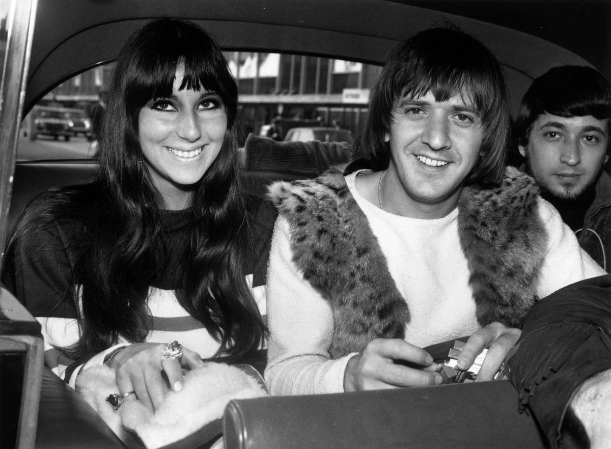 Cher and Sonny Bono ride in a car together.