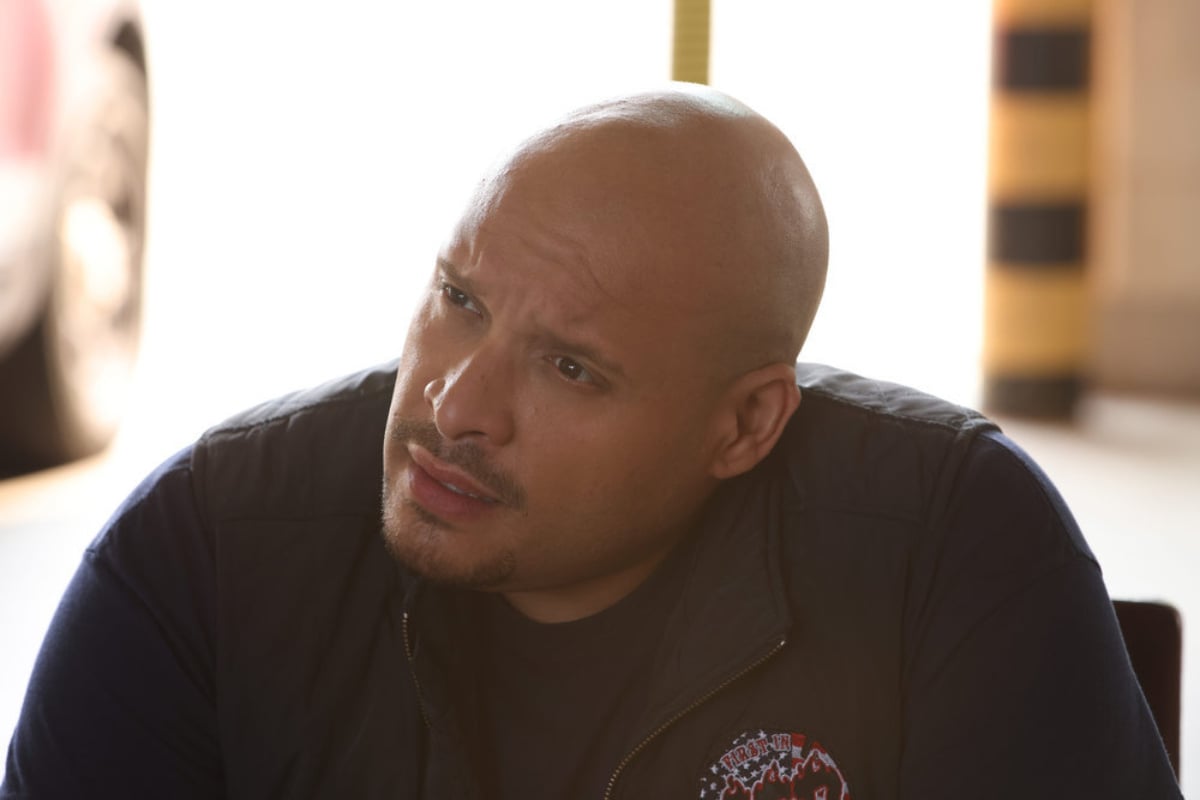 Joe Minoso as Joe Cruz in Chicago Fire Season 10. Joe looks concerned about something.