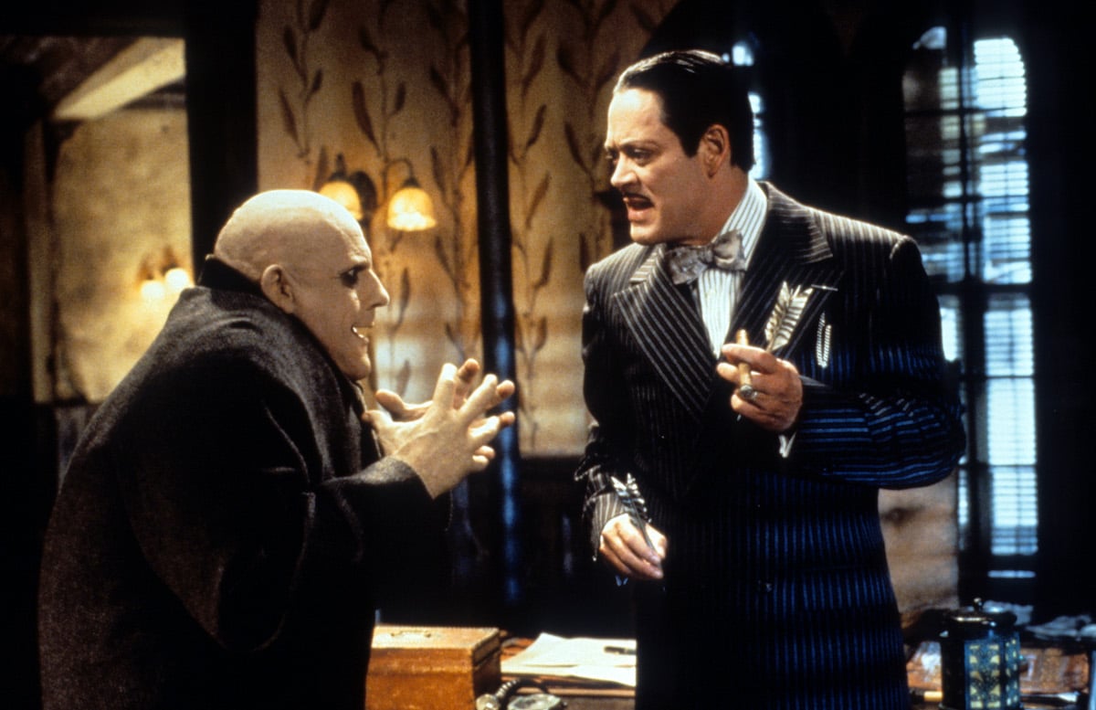 Christopher Lloyd and Raul Julia talking in a scene from the movie 'Addams Family Values' 