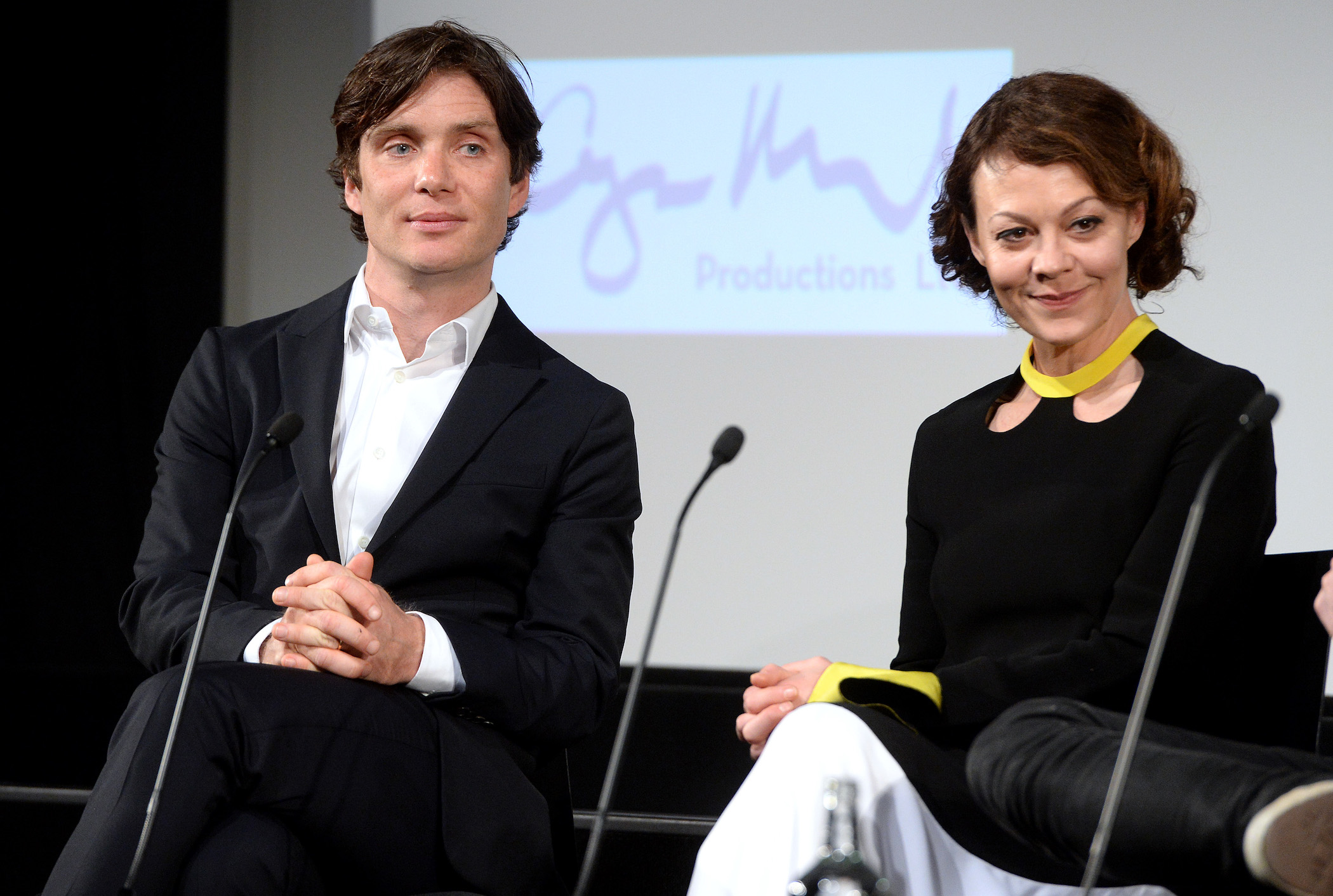 'Peaky Blinders' Season 6 star Cillian Murphy and Helen McCrory sitting on a stage at an event for the show. Cillian Murphy plays Thomas Shelby and Helen McCrory plays Polly Gray