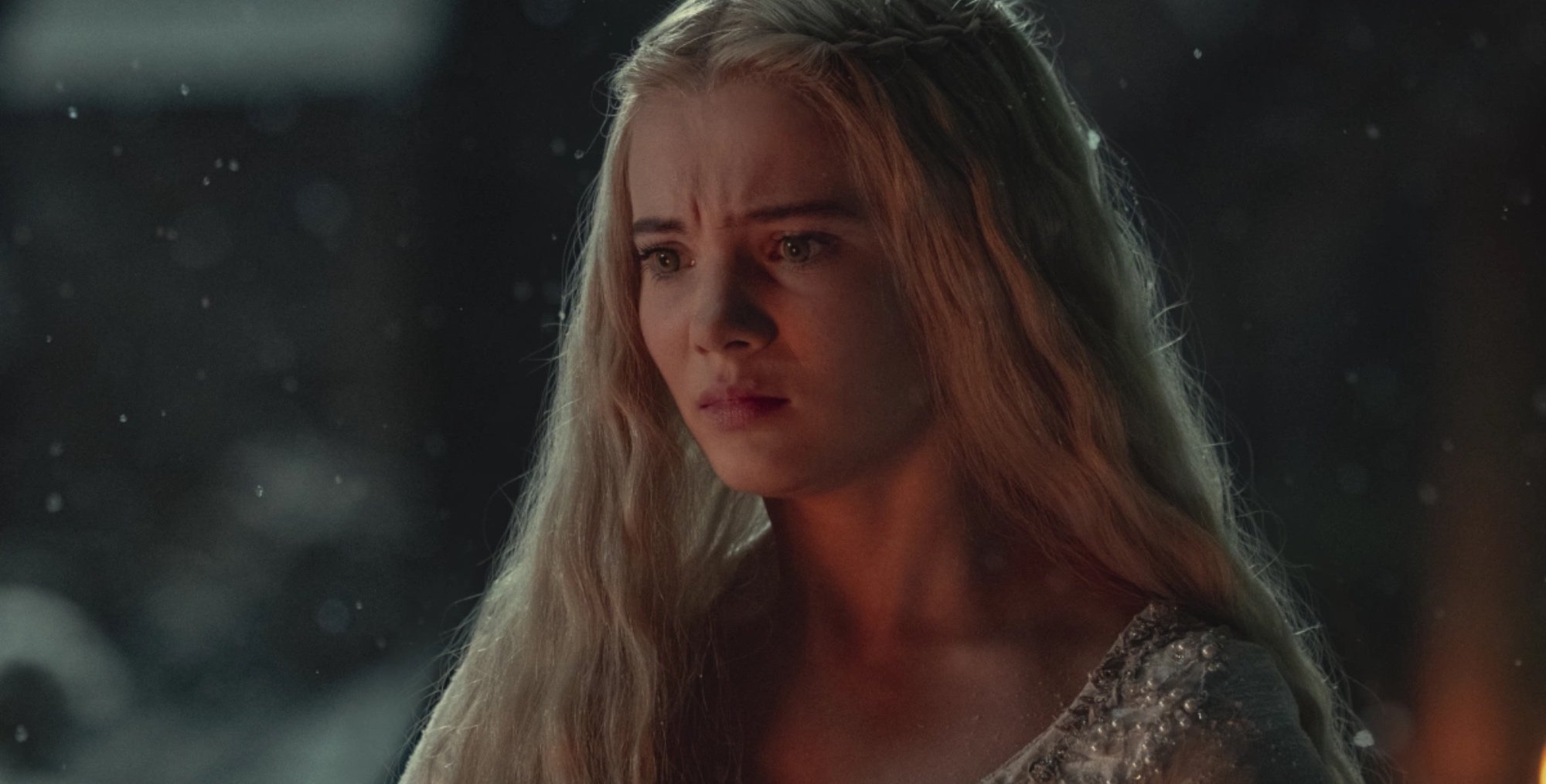 Ciri in 'The Witcher' Season 2, Episode 1 wearing white dress outside.