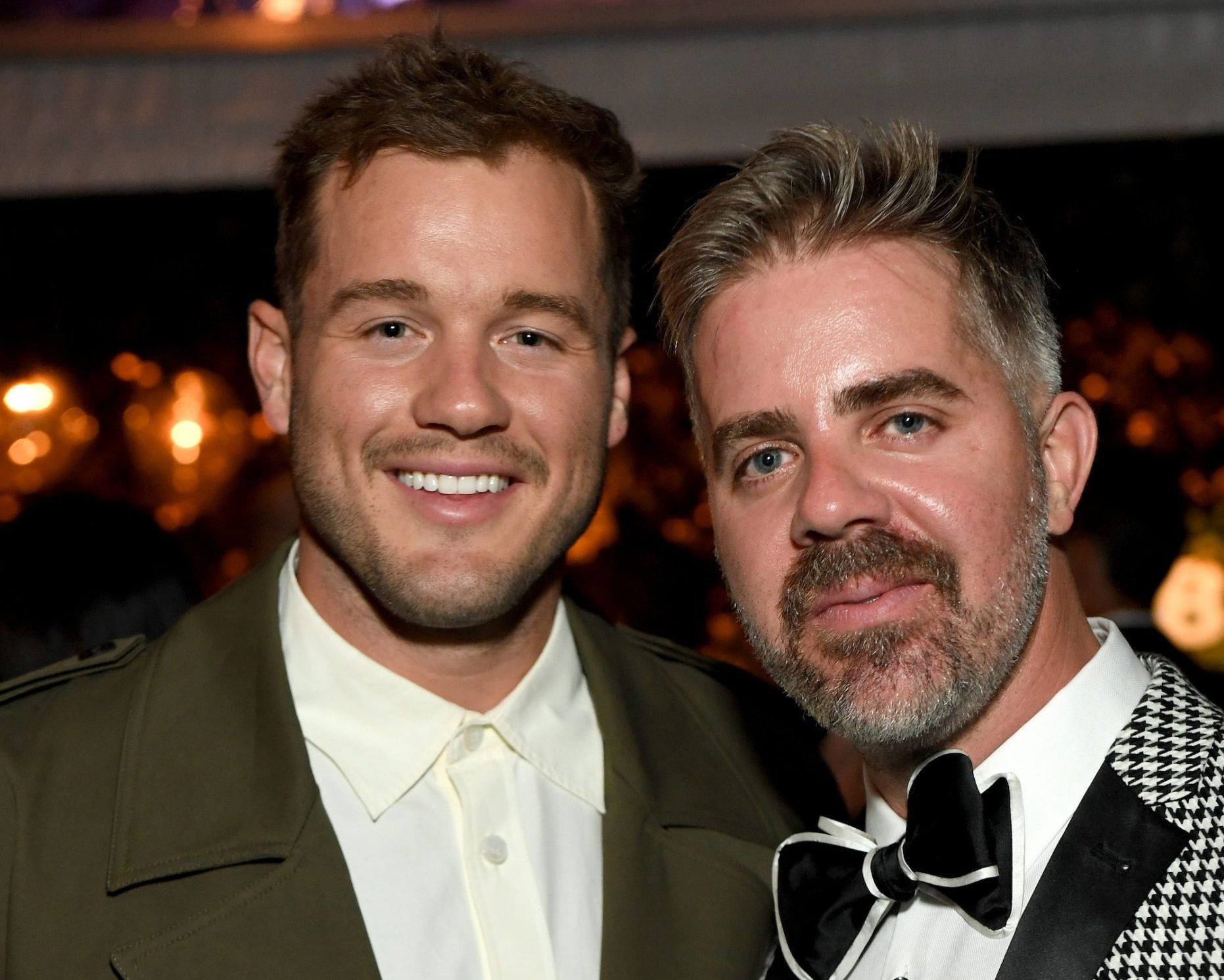 Colton Underwood and Jordan C. Brown are both dressed in suits while attending the Baby2Baby 10-Year Gala.