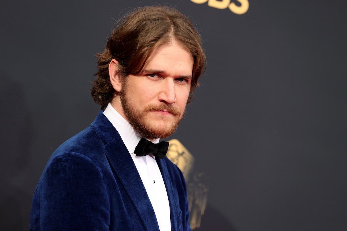 Bo Burnham attends the 73rd Primetime Emmy Awards in a blue velvet tuxedo