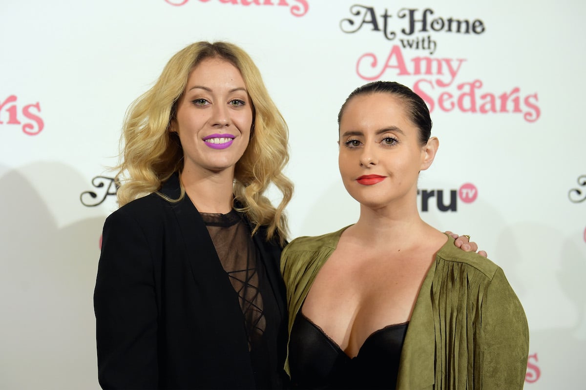 Krystyna Hutchinson and Corinne Fisher smiling in front of a white background