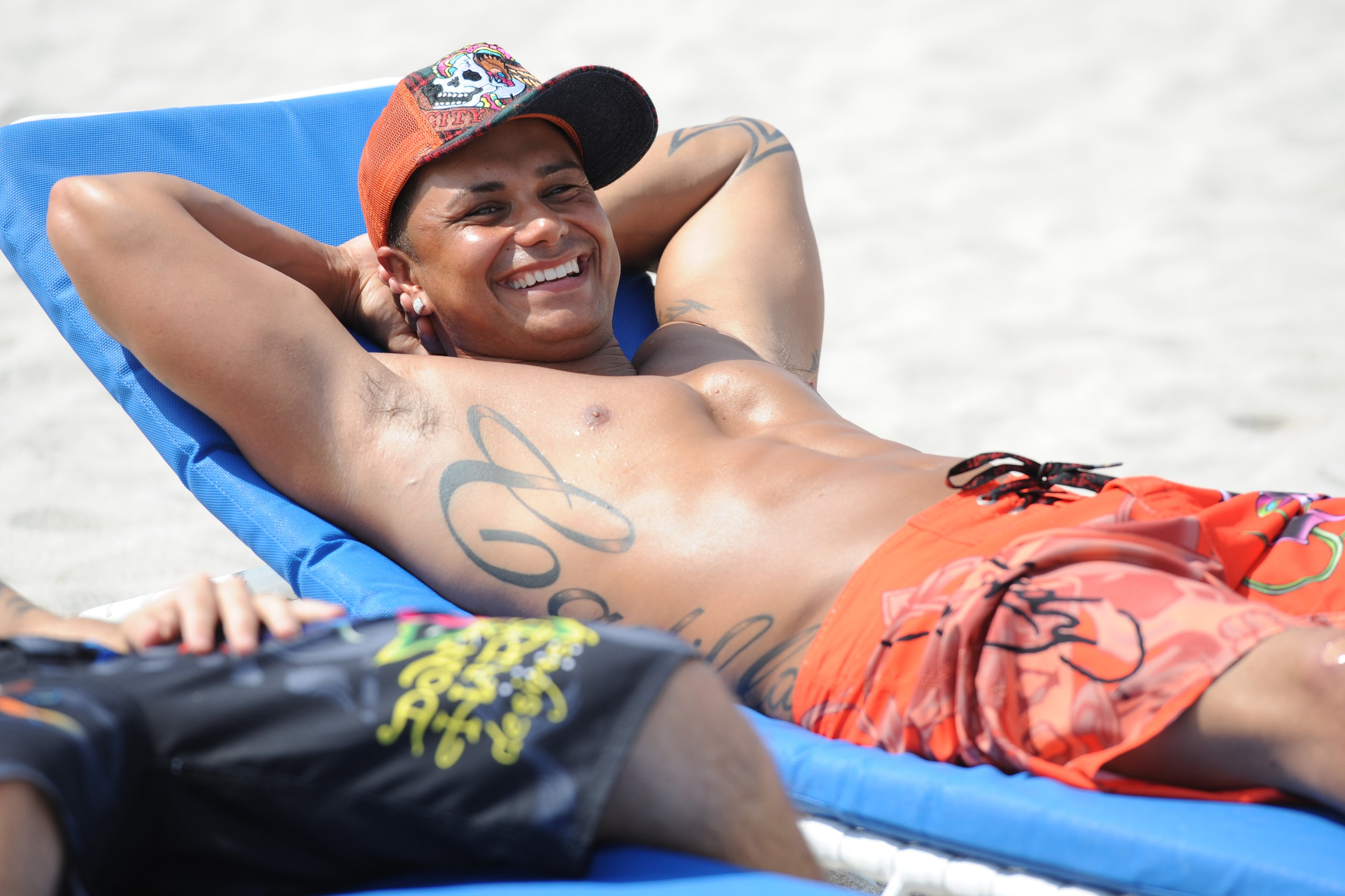 DJ Pauly DelVecchio lounging on the beach during the Miami season of 'Jersey Shore'