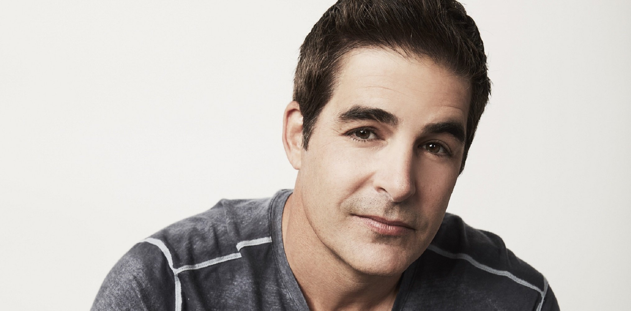 Days of Our Lives spoilers focus on Rafe, pictured here in a grey sweater