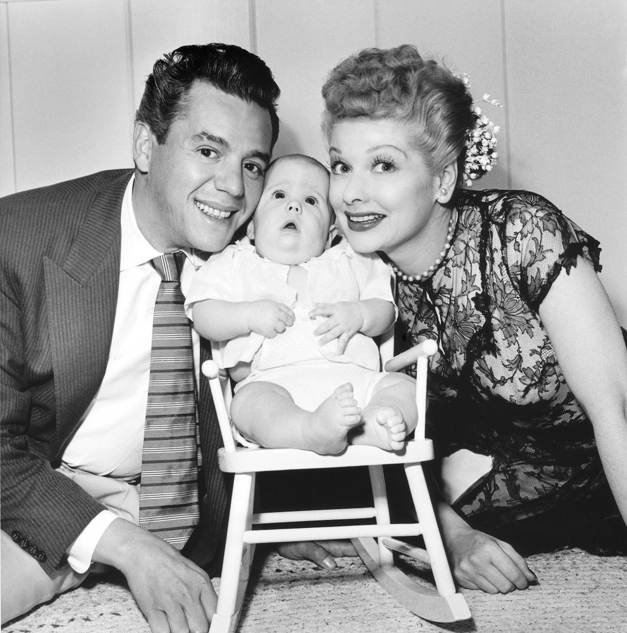 Desi Arnaz and Lucille Ball  pose with their son Desi Arnaz Jr. at their home in California,