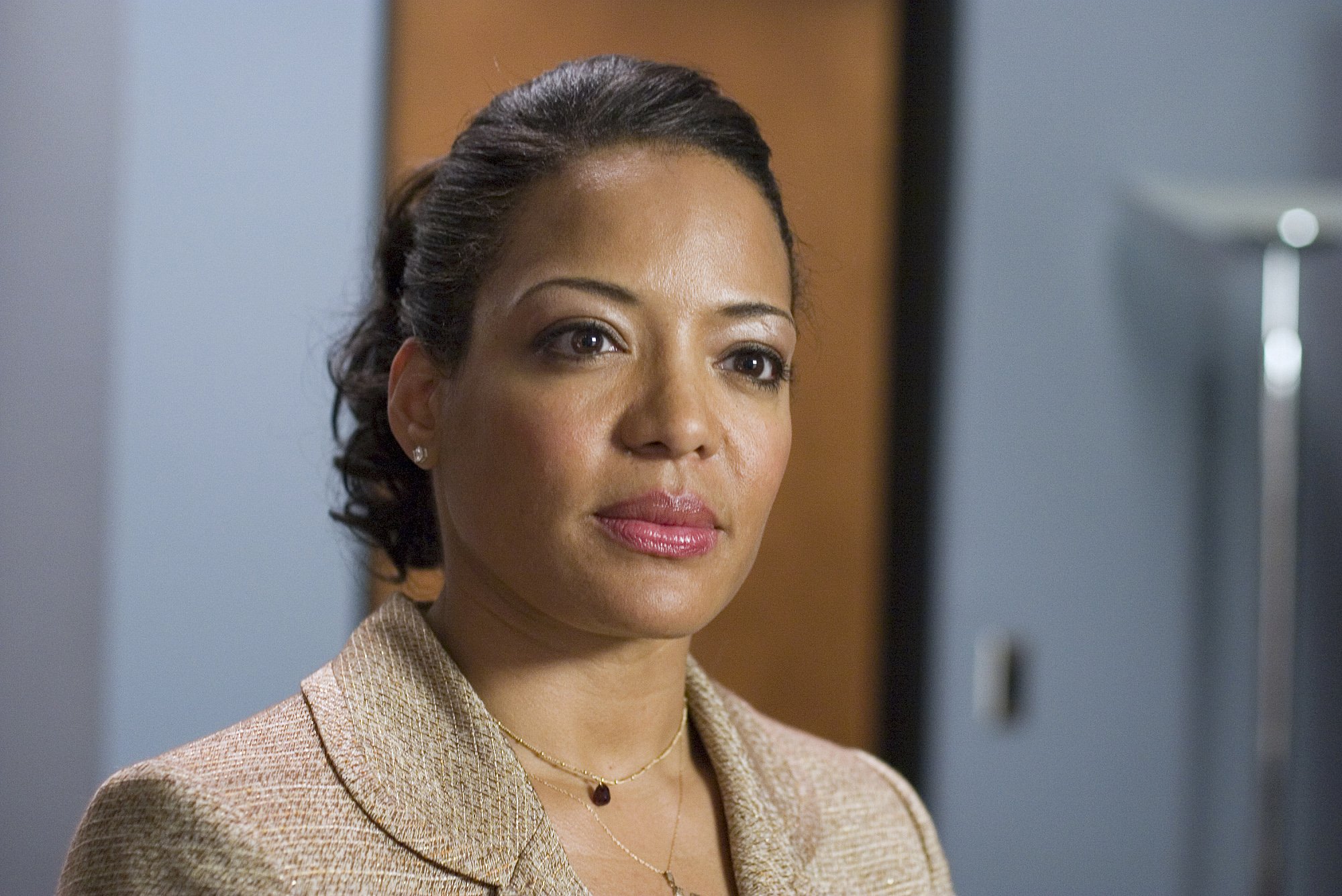 Lauren Velez as Lt. Maria LaGuerta in Dexter. LaGuerta has her hair pulled back in a ponytail.