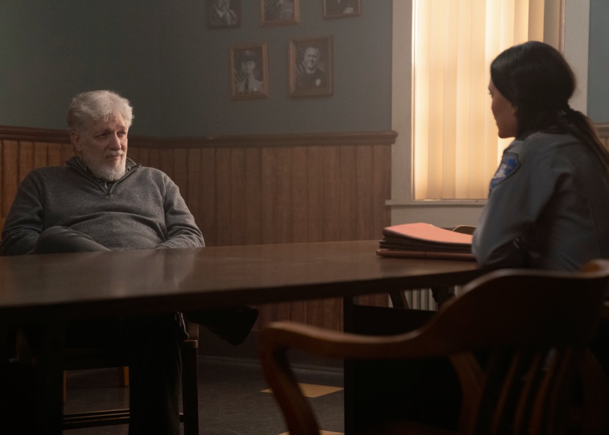 Clancy Brown as Kurt and Julia Jones as Angela in Dexter: New Blood Episode 7. Kurt sits across the table from Angela at the police department.