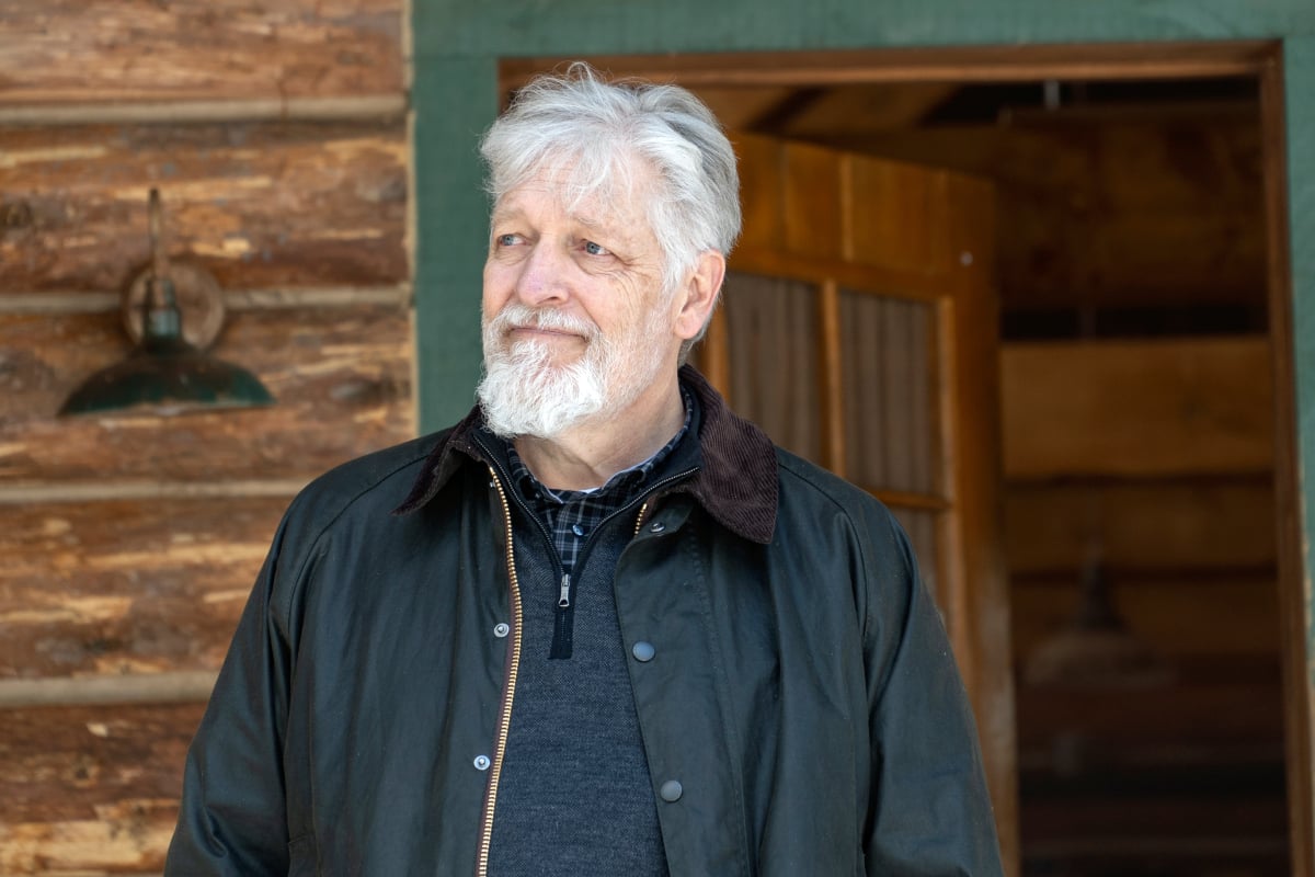 Clancy Brown as Kurt in Dexter: New Blood. Kurt stands outside a cabin.