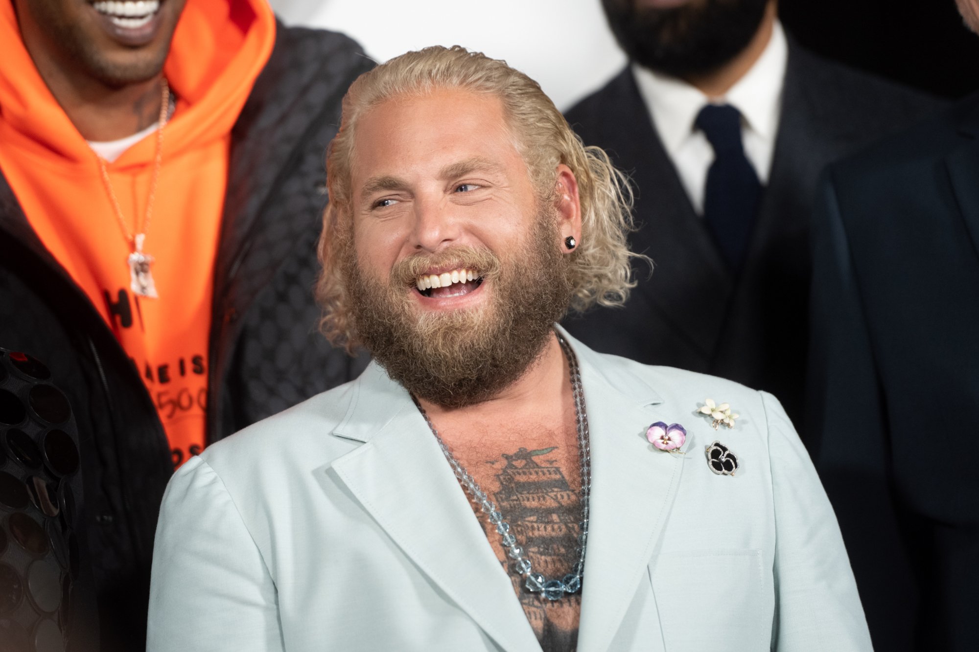 'Don't Look Up' star Jonah Hill smiling in a light colored blazer