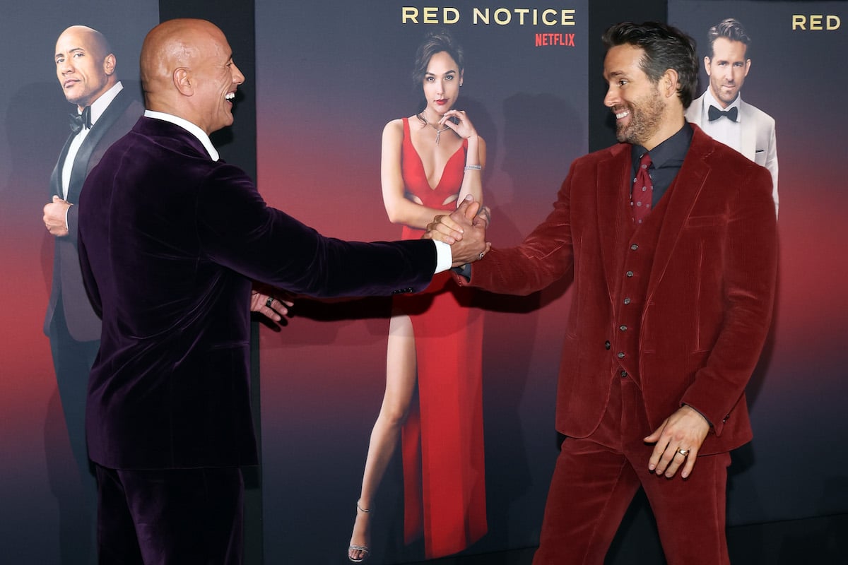 Dwayne Johnson greets Ryan Reynolds at the world premiere of Netflix's 'Red Notice' at L.A. LIVE