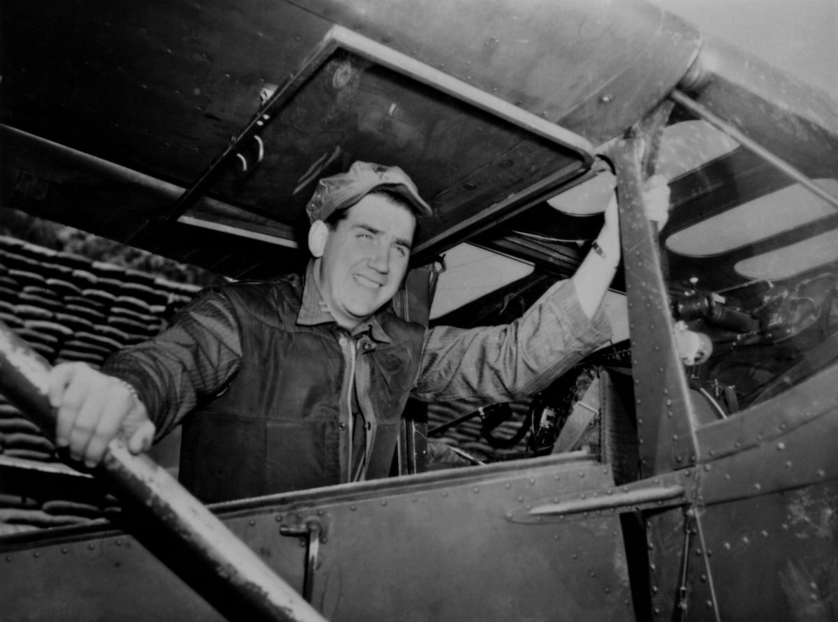 Ed McMahon enters his unarmed O-1E Bird Dog used for aerial observation (c. 1953 in Korea)