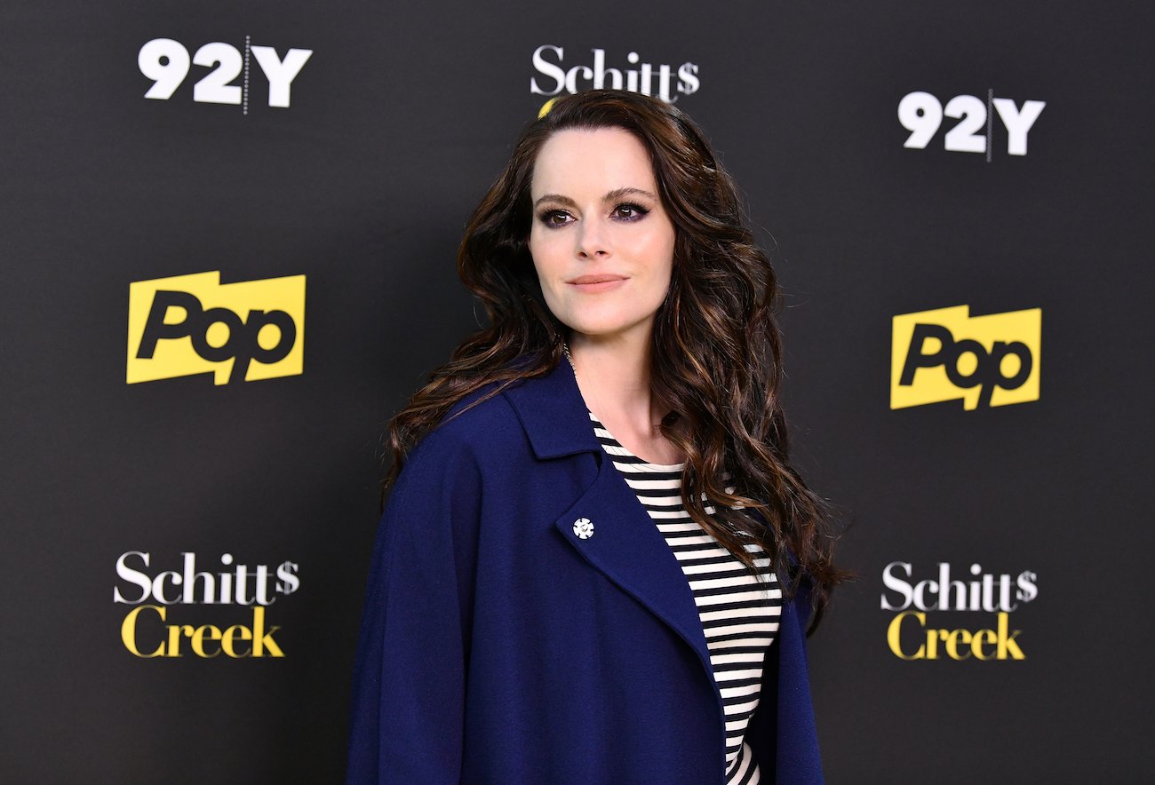 Stevie Budd's Emily Hampshire poses at a 'Schitt's Creek' event