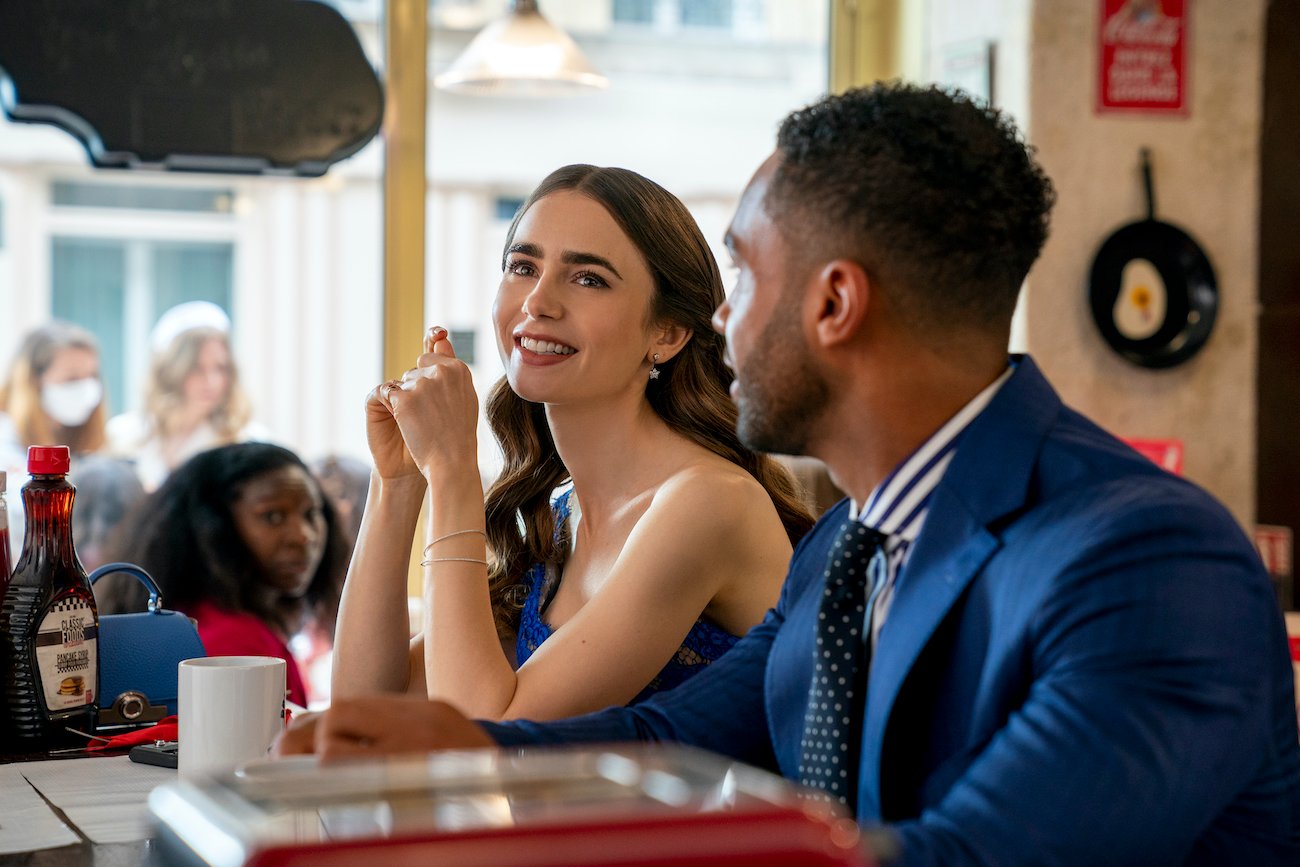 Lily Collins as Emily, Lucien Laviscount as Alfie in the Netflix series 'Emily in Paris'