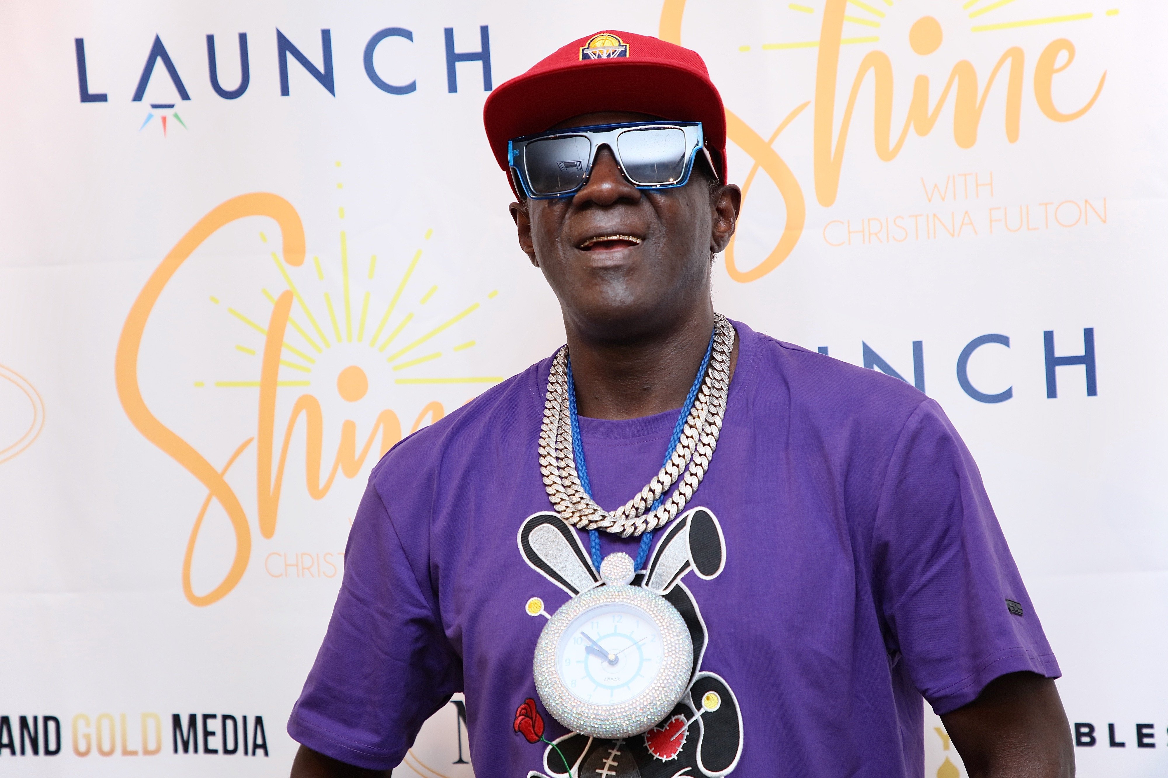 Flavor Flav wearing purple