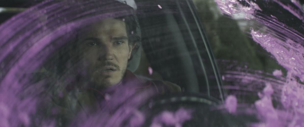 Fra Fee as Kazi in 'Hawkeye' seen behind a purple colored windshield