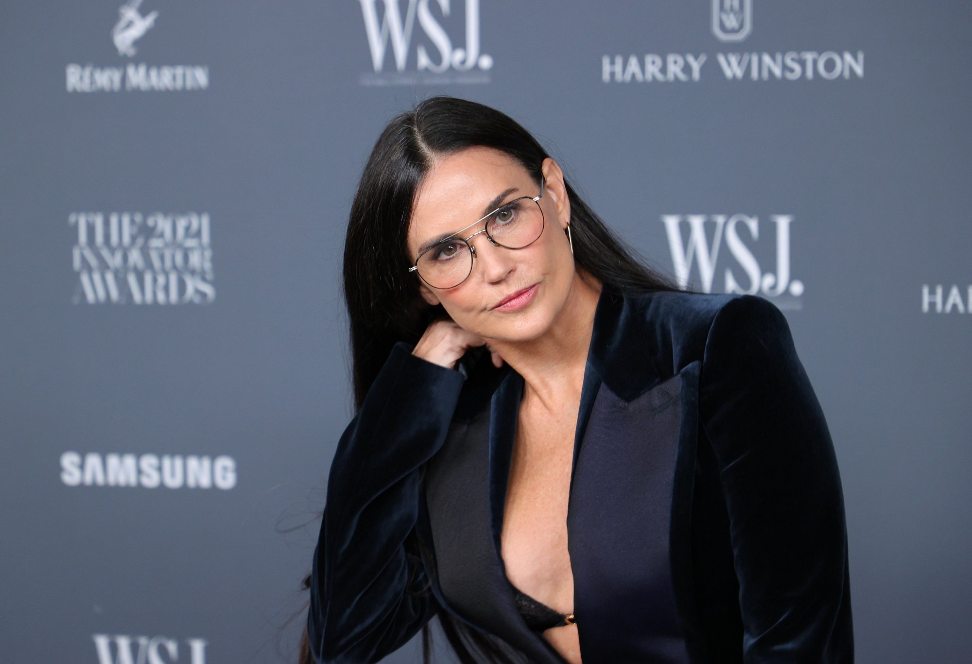 General Hospital star Demi Moore, whose co-star was John Stamos, in a blue jacket and glasses