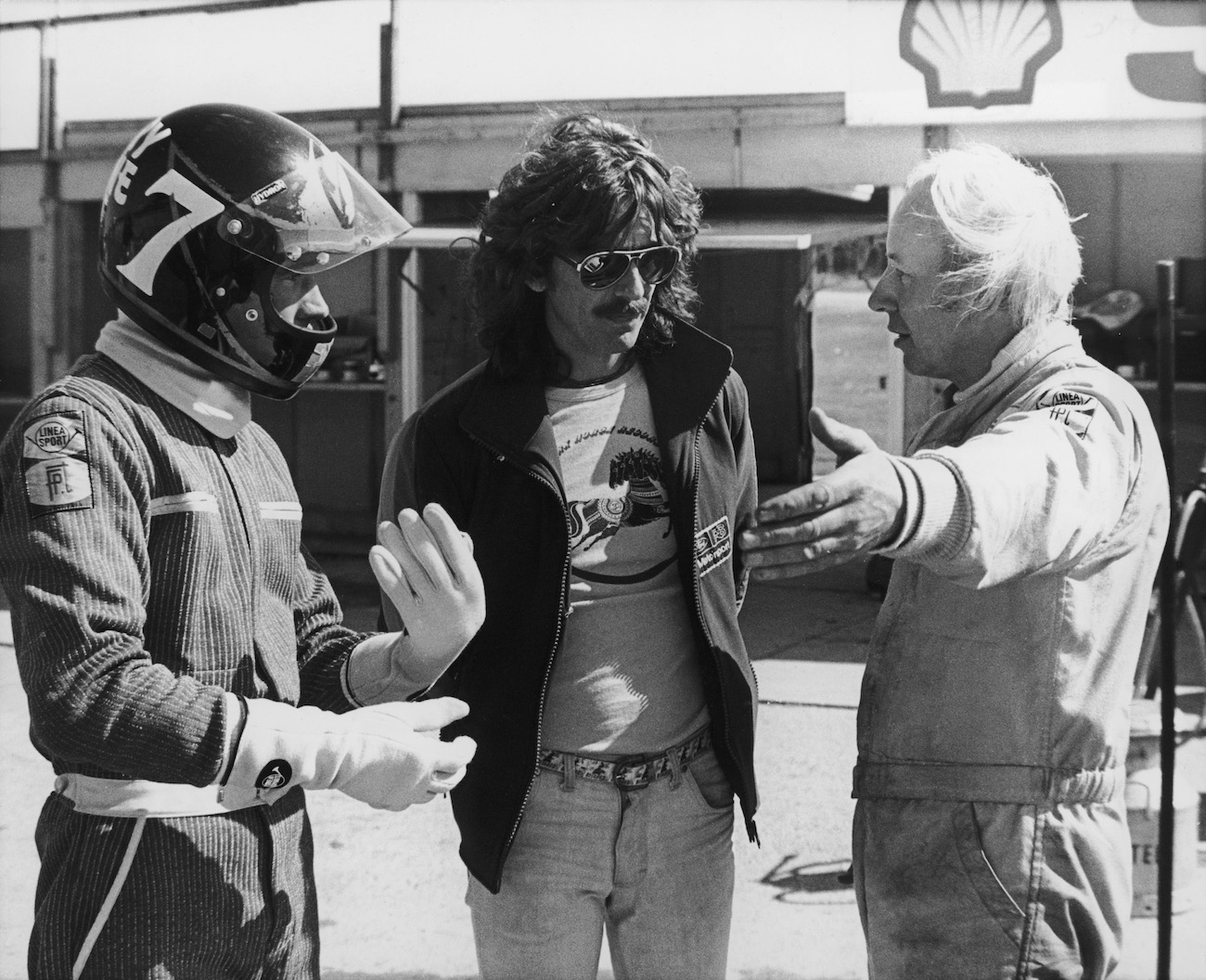 Ex-Beatle, George Harrison, with Barry Sheene and John Surtees at a Formula One race in 1978.