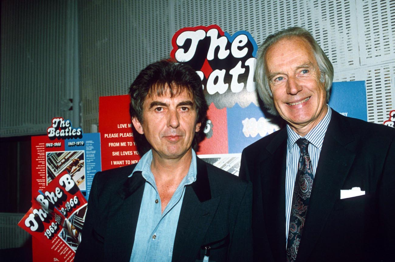 George Harrison and George Martin in suits at a Beatles event in 1993.