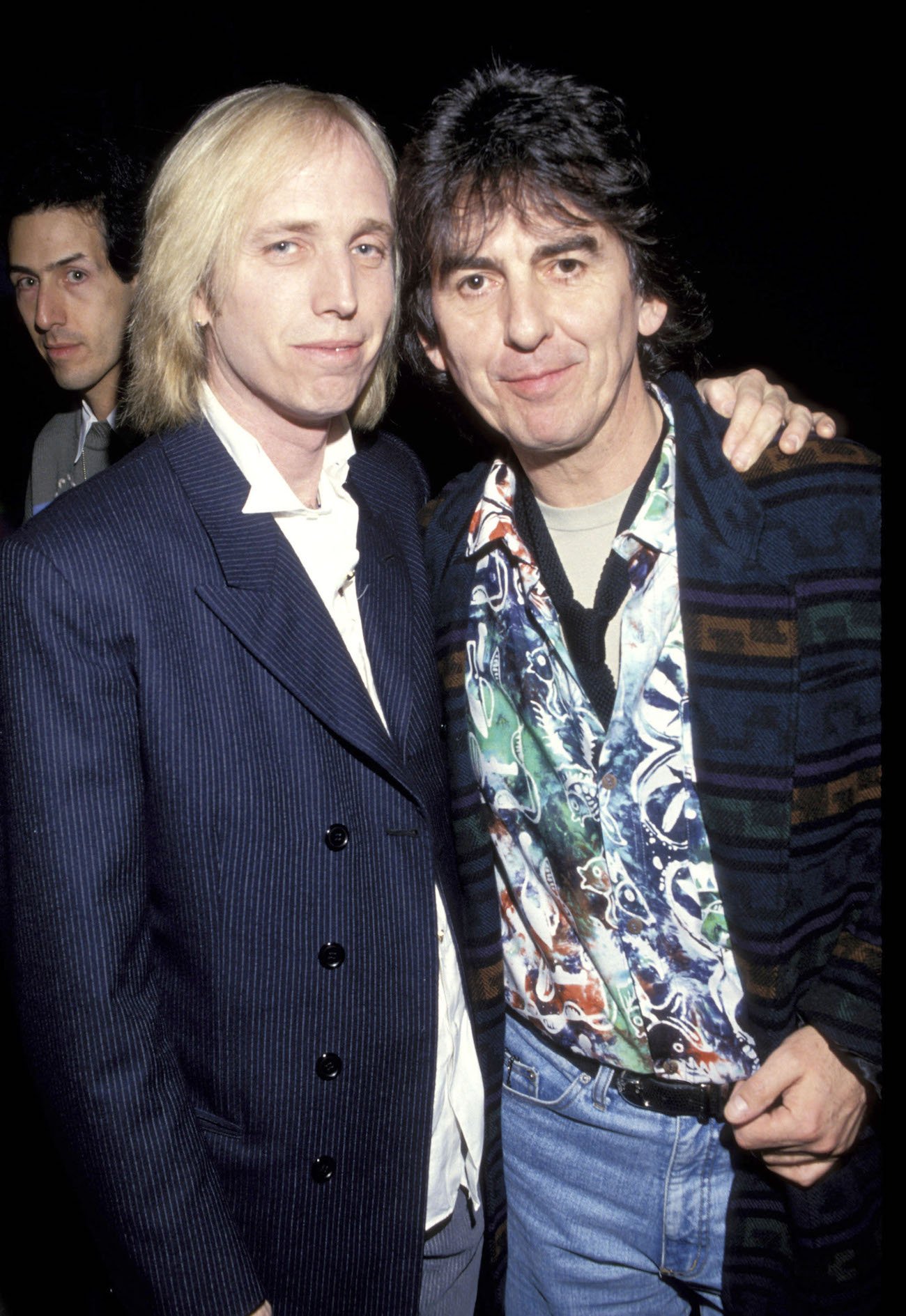 Tom Petty and George Harrison embracing at the 2000 Billboard Music Awards. 