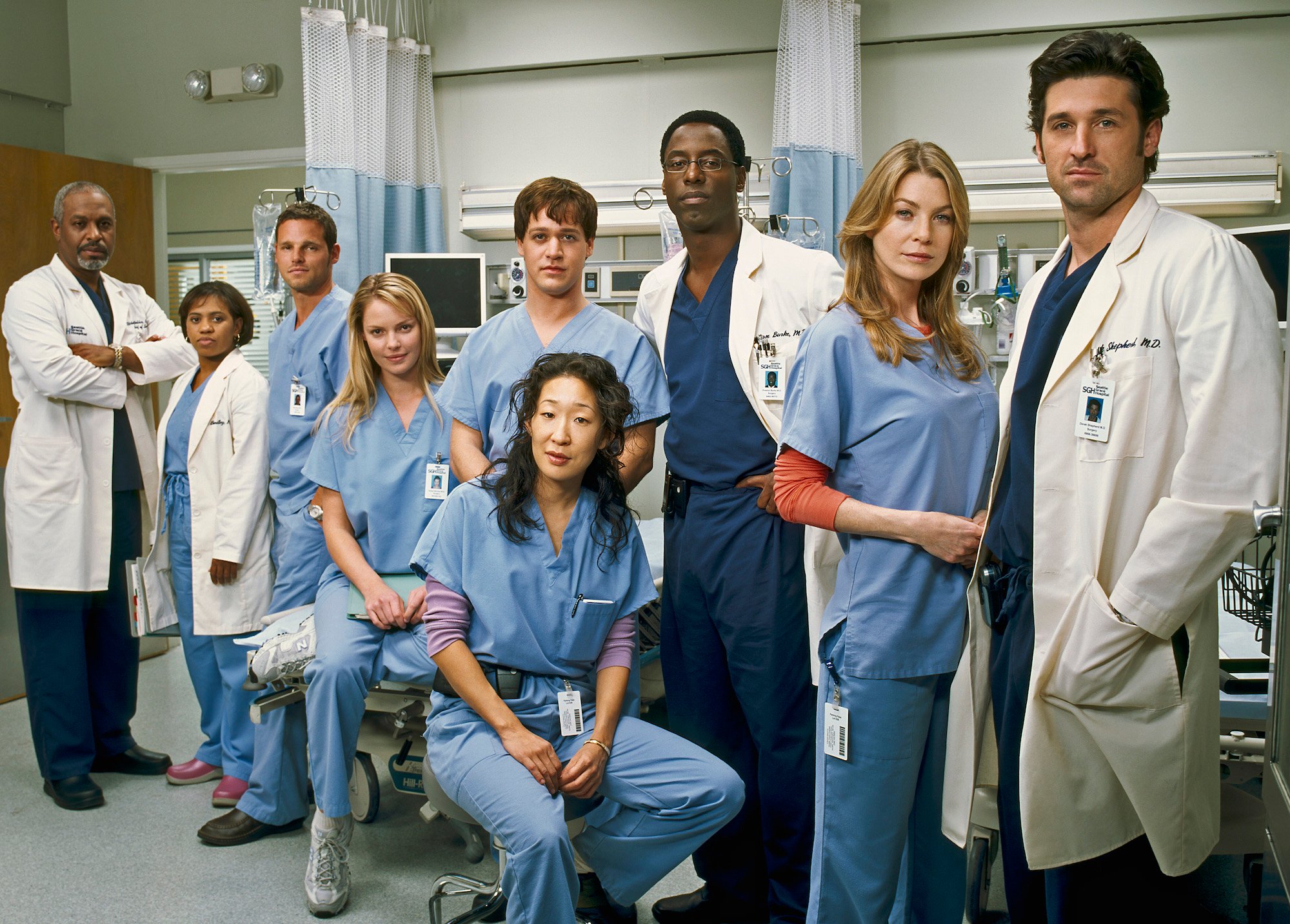 The 'Grey's Anatomy' cast dressed in blue and white scrubs.