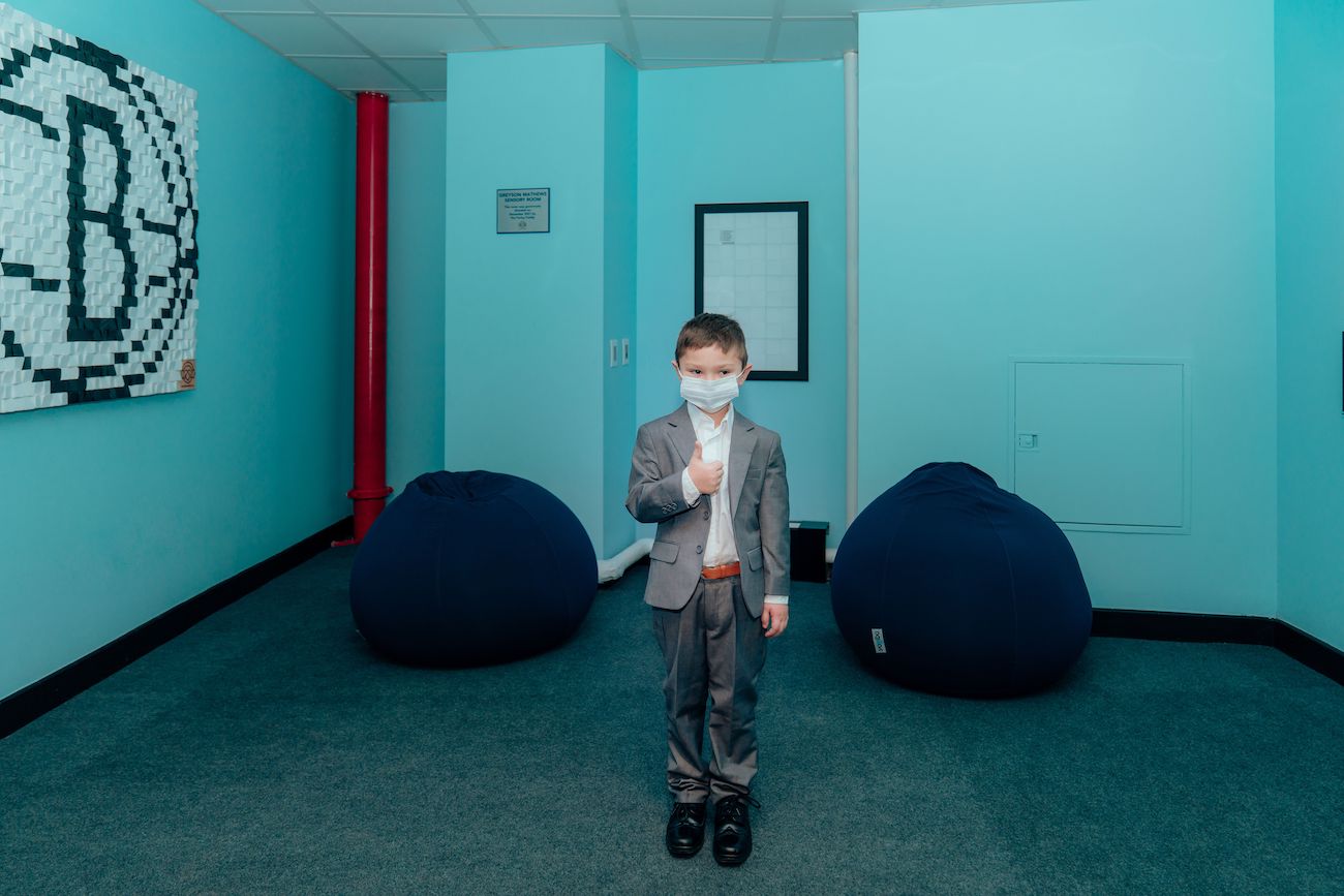 Greyson Mathews poses with his thumbs up in the Greyson Mathews Sensory Room at the Barclays Center