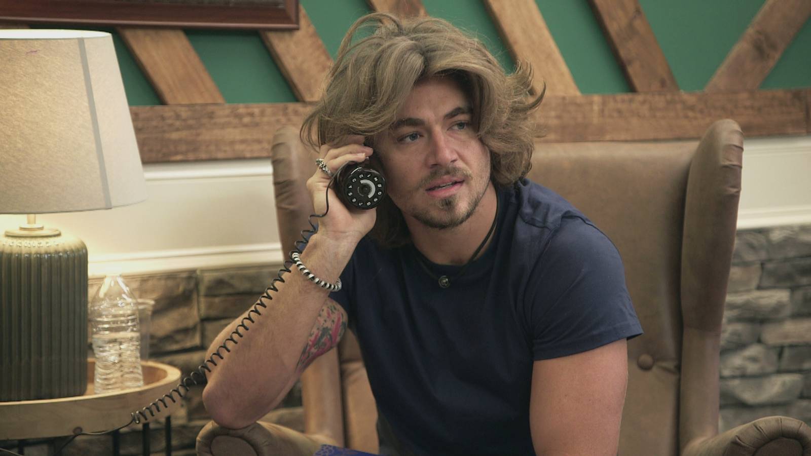 'Floribama Shore' star Gus Smyrnios holding the beer phone from the Peach House in season 4
