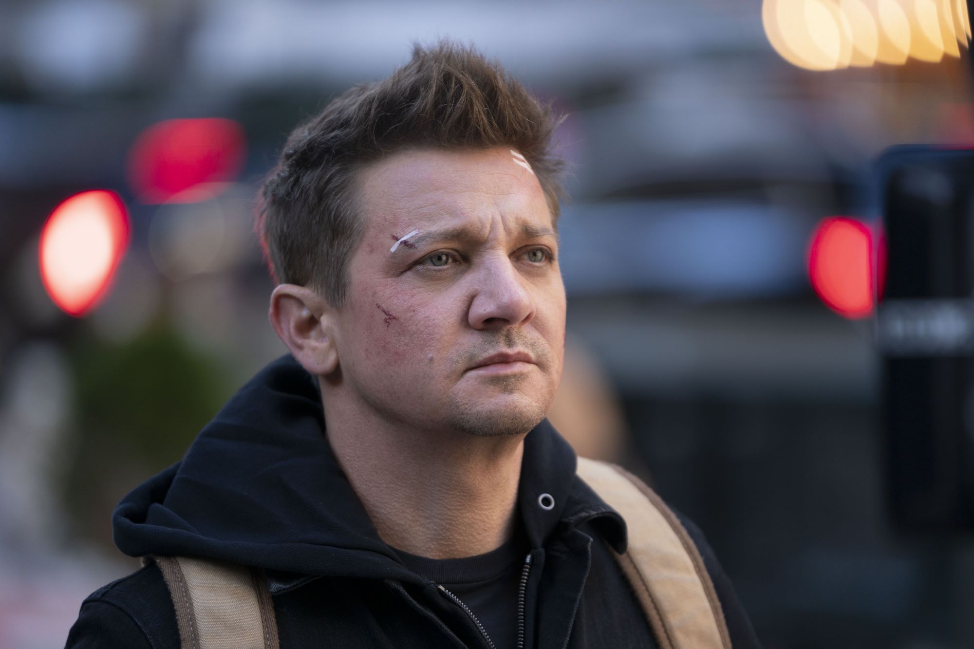 Jeremy Renner as Clint Barton with cuts on his face in a scene from 'Hawkeye'