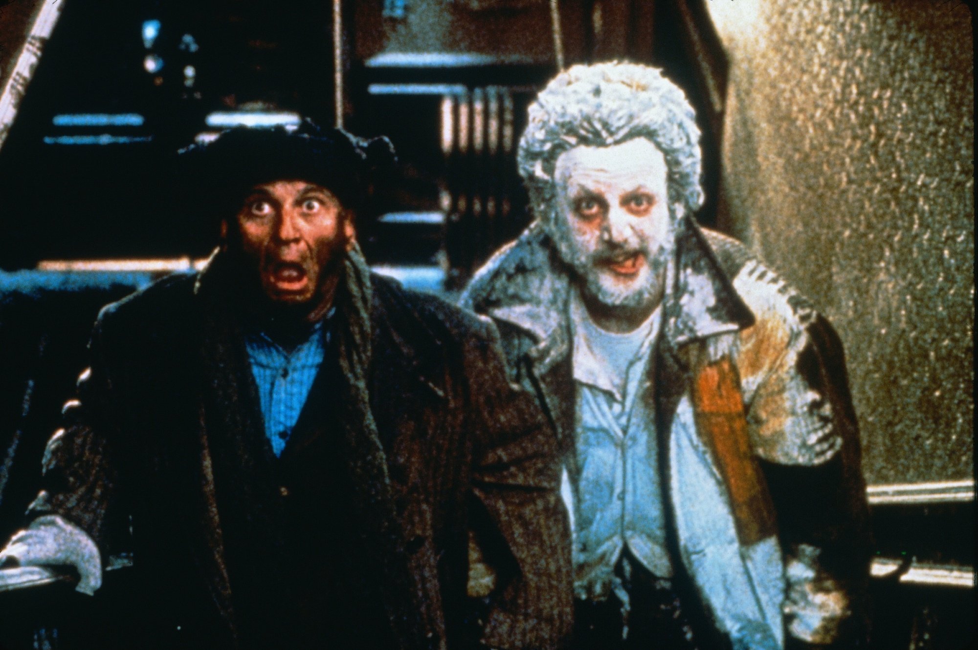 'Home Alone' Joe Pesci as Harry and Daniel Stern as Marv for article about tarantula standing with powdered face and hat burnt off