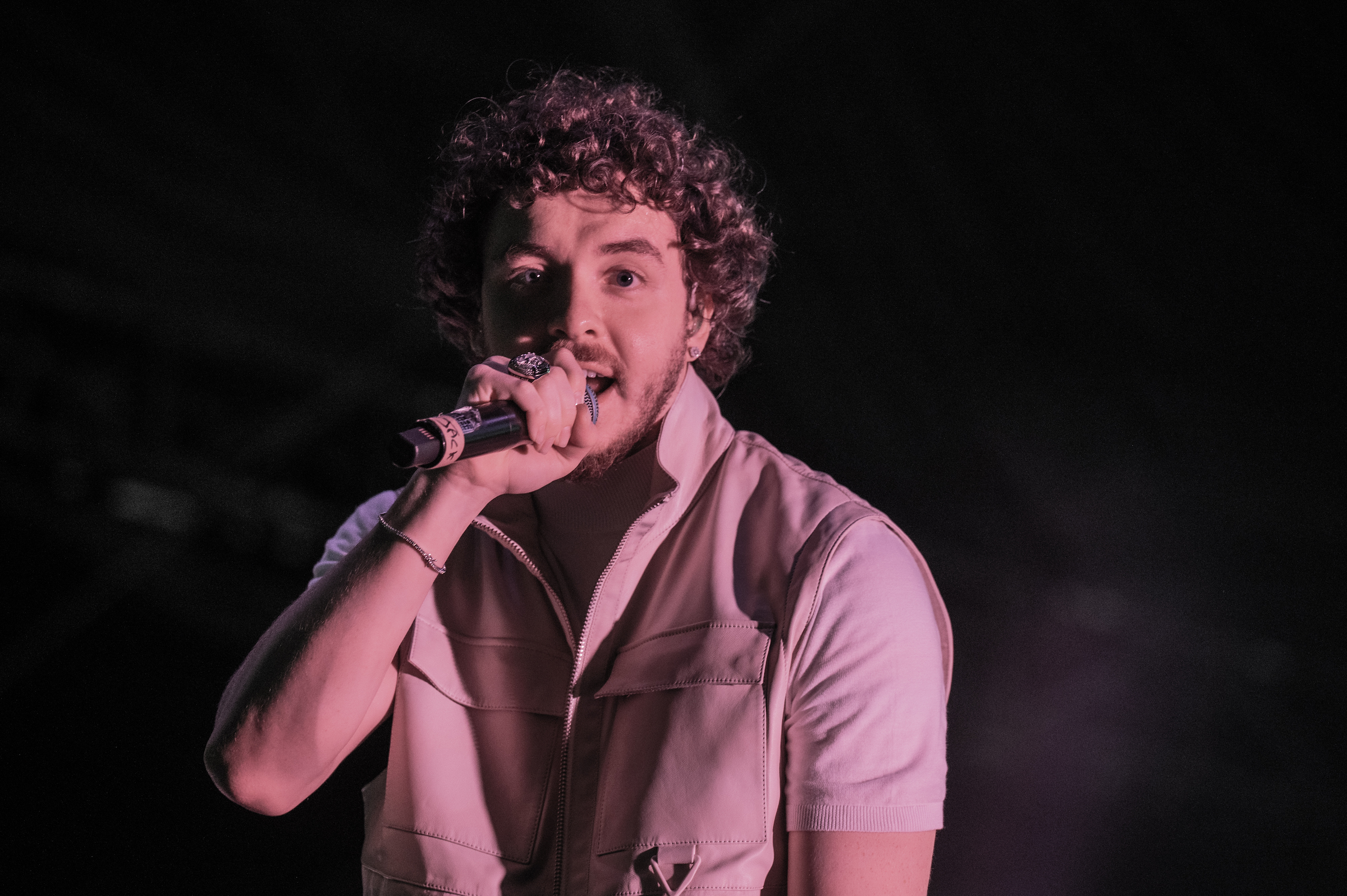 Jack Harlow performing with a mic