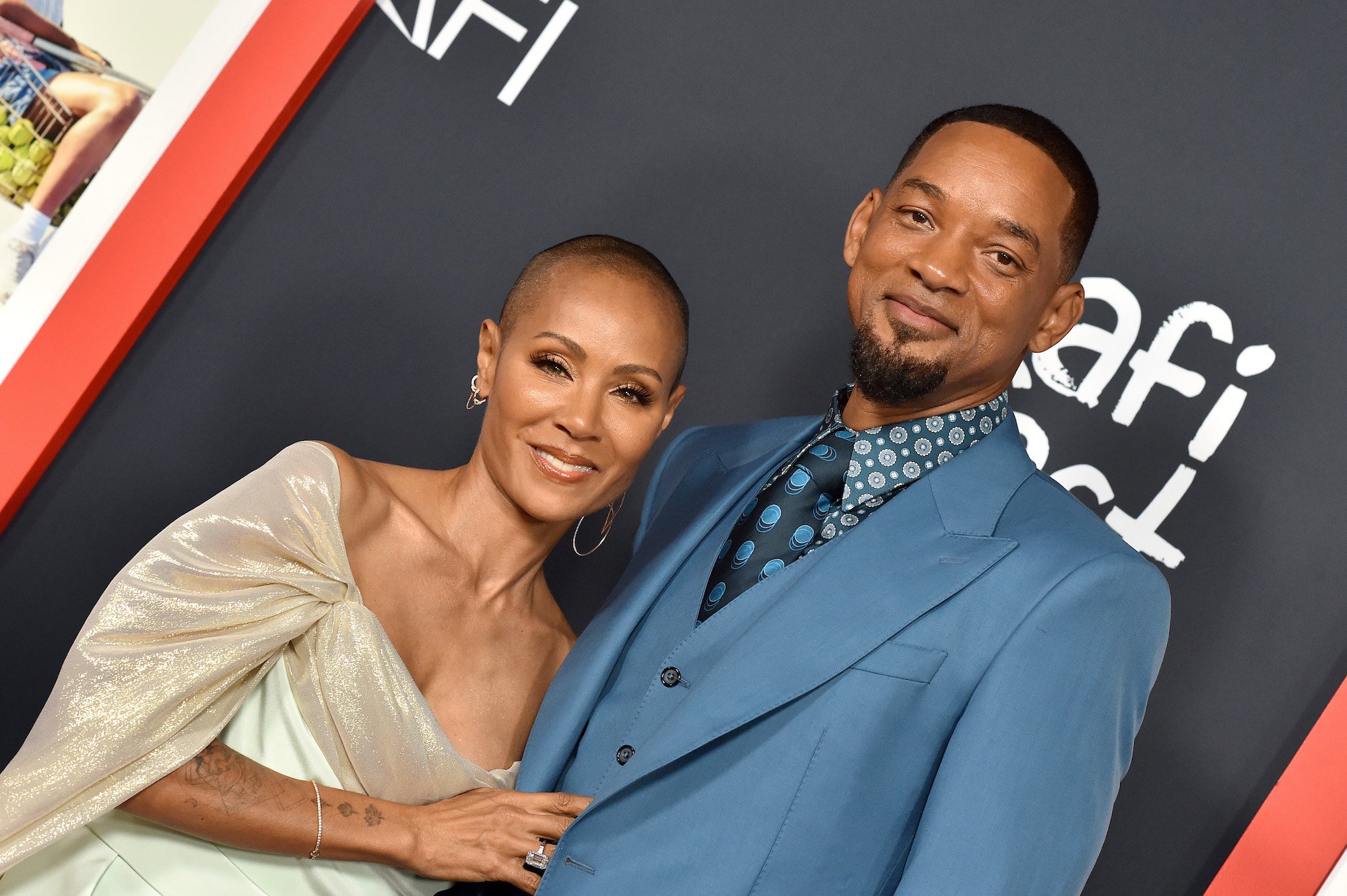 Jada Pinkett Smith holds onto Will Smith's jacket