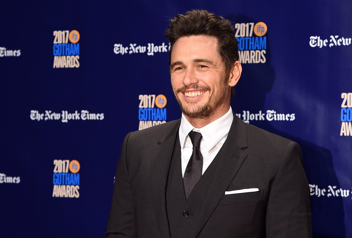 James Franco smiling in a suit
