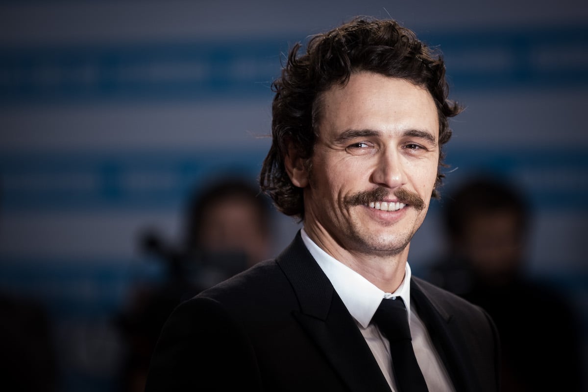 James Franco smiles for the camera at an event.