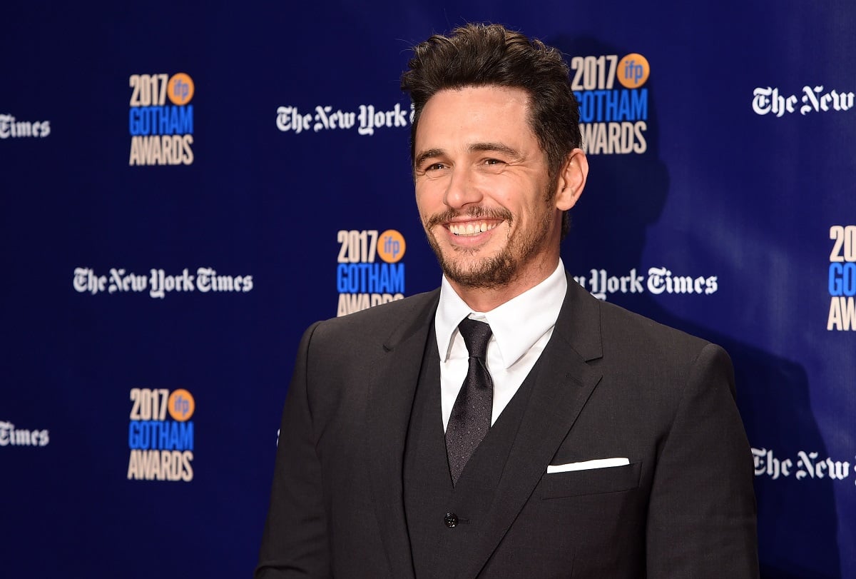 James Franco smiling in a suit.