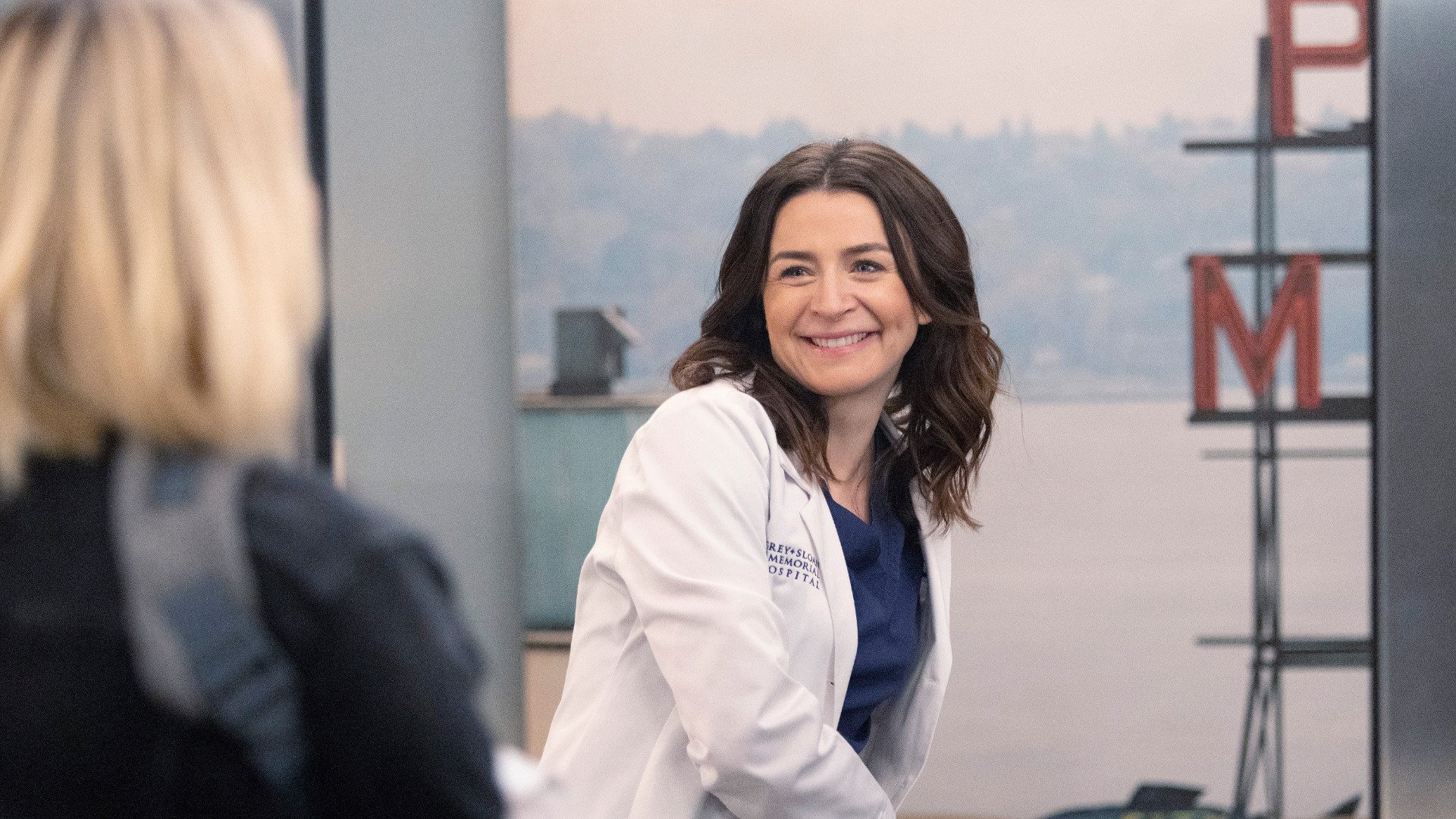 Caterina Scorsone Amelia Shepherd smiles at Camilla Luddington as Jo Wilson in ‘Grey’s Anatomy’ Season 18 Episode 8