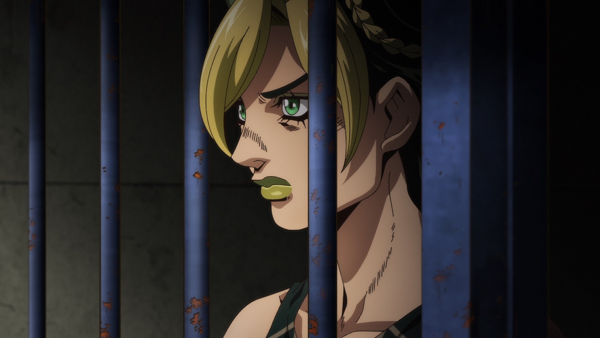 Jolyne Cujoh in 'JoJo's Bizarre Adventure: Stone Ocean' on Netflix. She's looking out from behind bars.