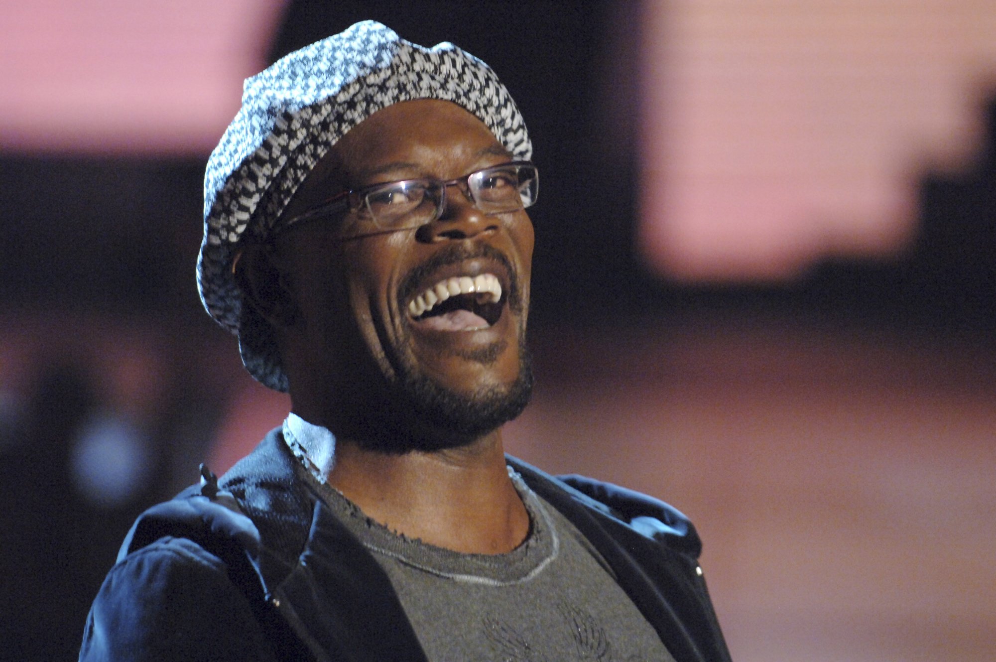 'Jurassic Park' actor Samuel L. Jackson smiling with hat and glasses