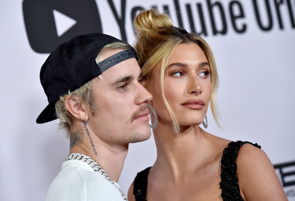 Justin Bieber and Hailey Bieber pose together at an event.